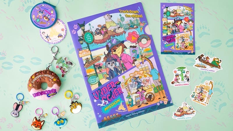 Zootopia 2 merchandise—posters, pins, and a donut-shaped item—on a mint background, styled like Disney Parks exclusives.