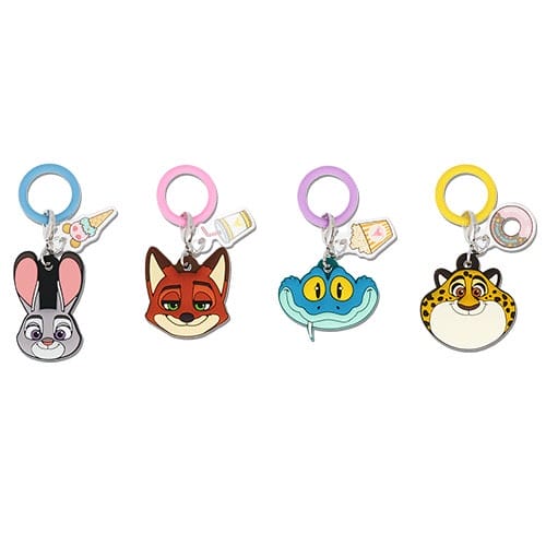 Four cartoon animal keychains—bunny, fox, snake, and cheetah—Zootopia 2-style, like those found at Tokyo Disneyland.