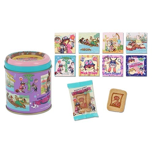 Zootopia 2 tin, eight cards, Tokyo Disneyland cookie and snack packet—merch exclusive to the park, shown on white background.