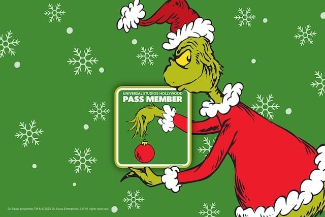 The Grinch dressed as Santa holds an ornament surrounded by snowflakes on a green background. A frame around his hand with the text "Universal Studios Hollywood Pass Member" indicates the magnet design.