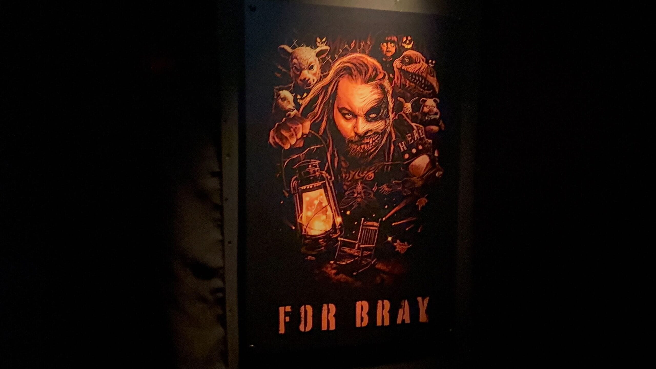 A moody poster features Wyatt Sicks with a lantern among eerie masks, "FOR BRAY" below; no Disney castle like those in the parks.