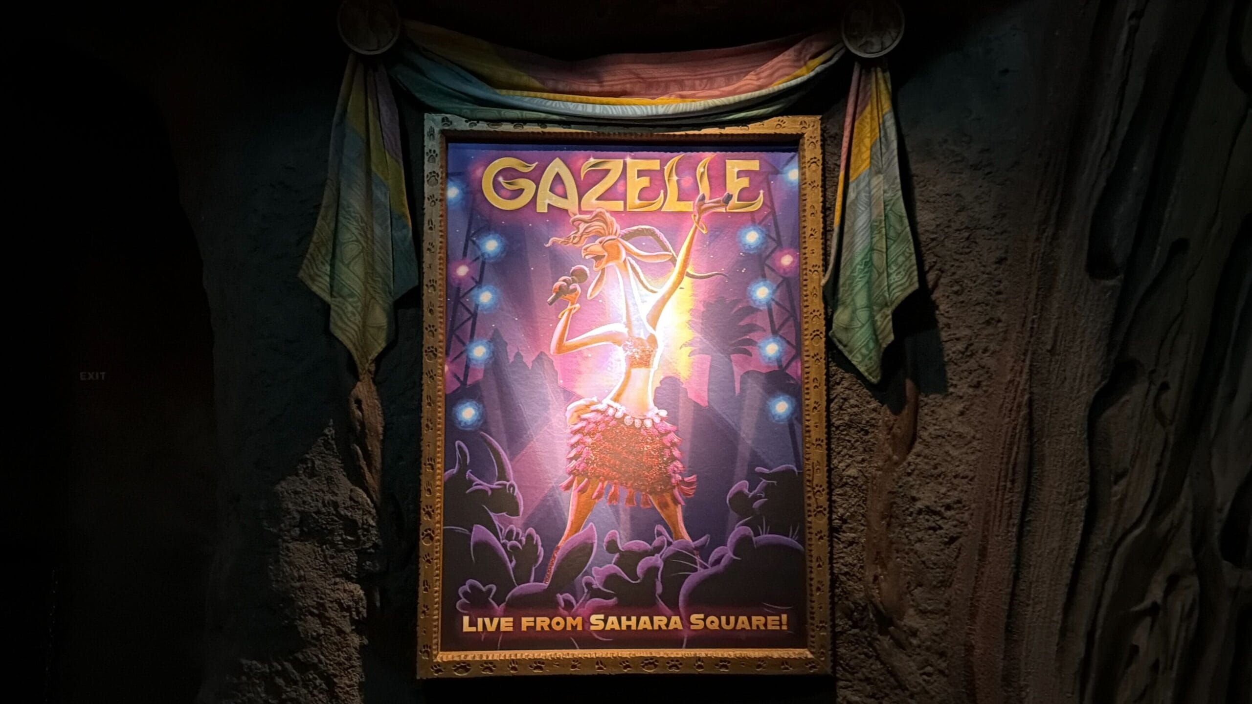 A vibrant poster of Gazelle singing on stage with "Live from Sahara Square!" text and cheering fans, similar to a Disney park concert.