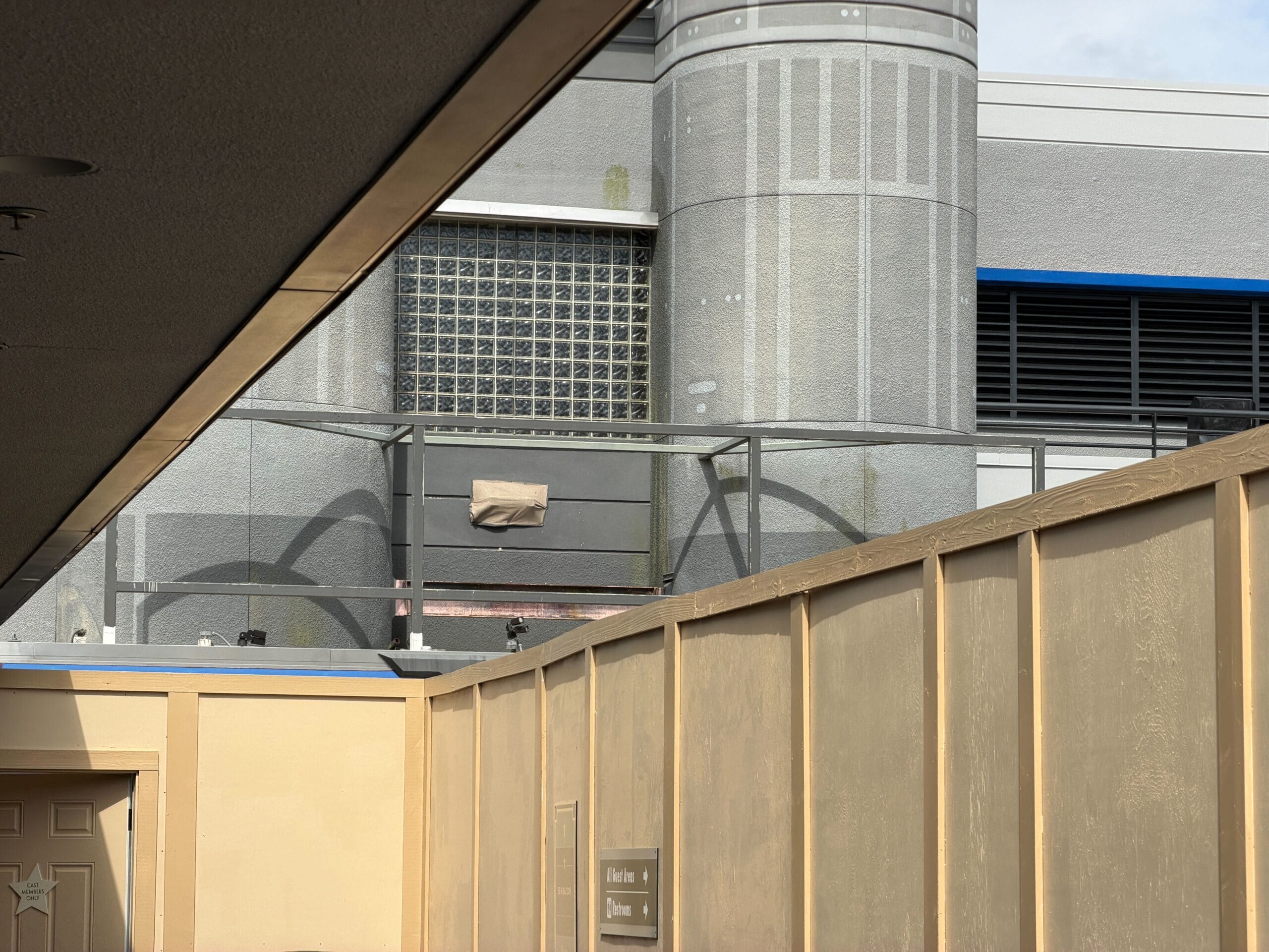A partially blocked, gray industrial building, formerly Star Wars Launch Bay, at Disney's Hollywood Studios—no castle in sight.