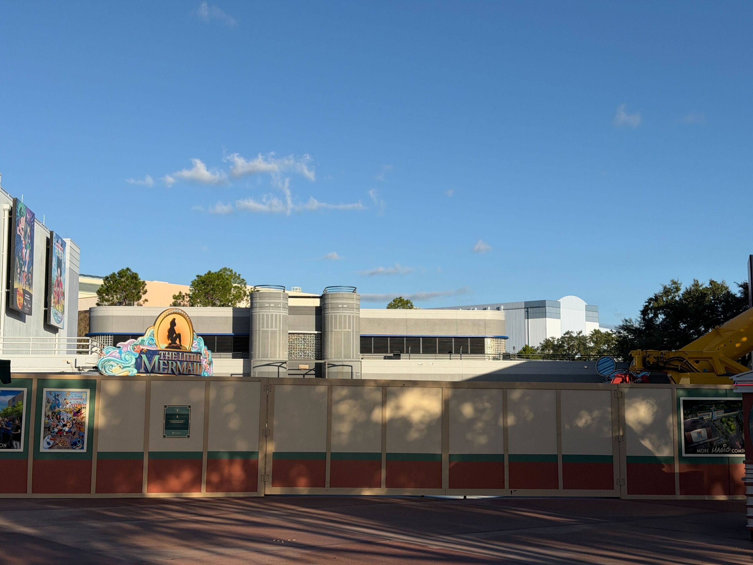 Construction walls block The Little Mermaid entrance in Animation Courtyard, arch removed; no castle like Cinderella Castle visible.