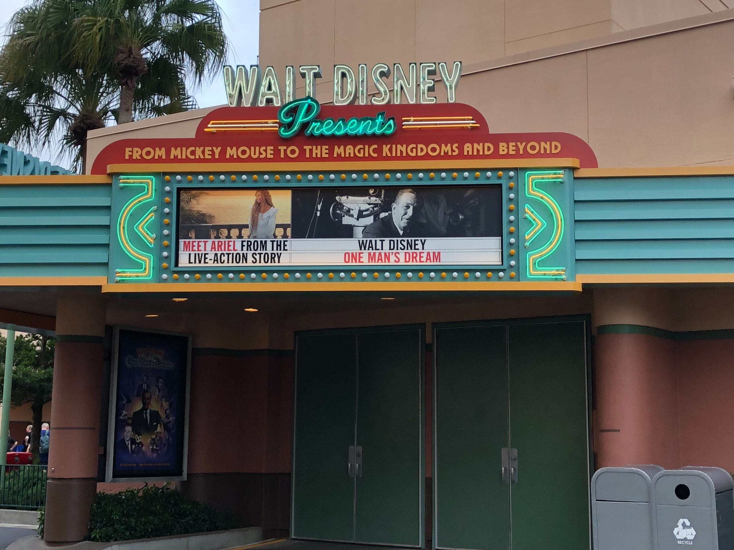 Theater marquee displays "Walt Disney Presents: From Mickey Mouse to Walt Disney World and Beyond," nodding to Disney park history.