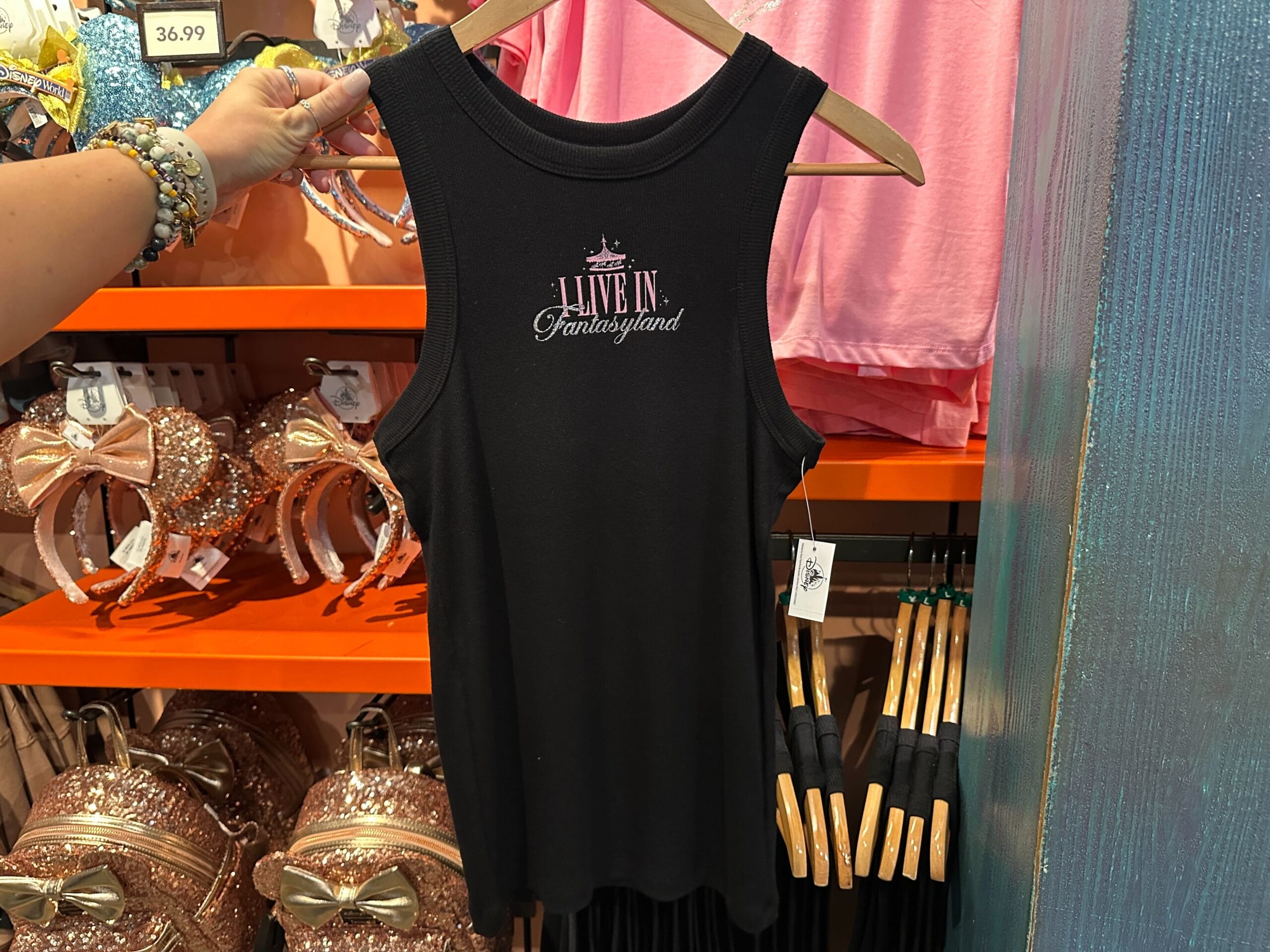 A black tank top inspired by Disney Parks T-Shirts, ideal for wearing while exploring any Disneyland or Magic Kingdom castle worldwide.