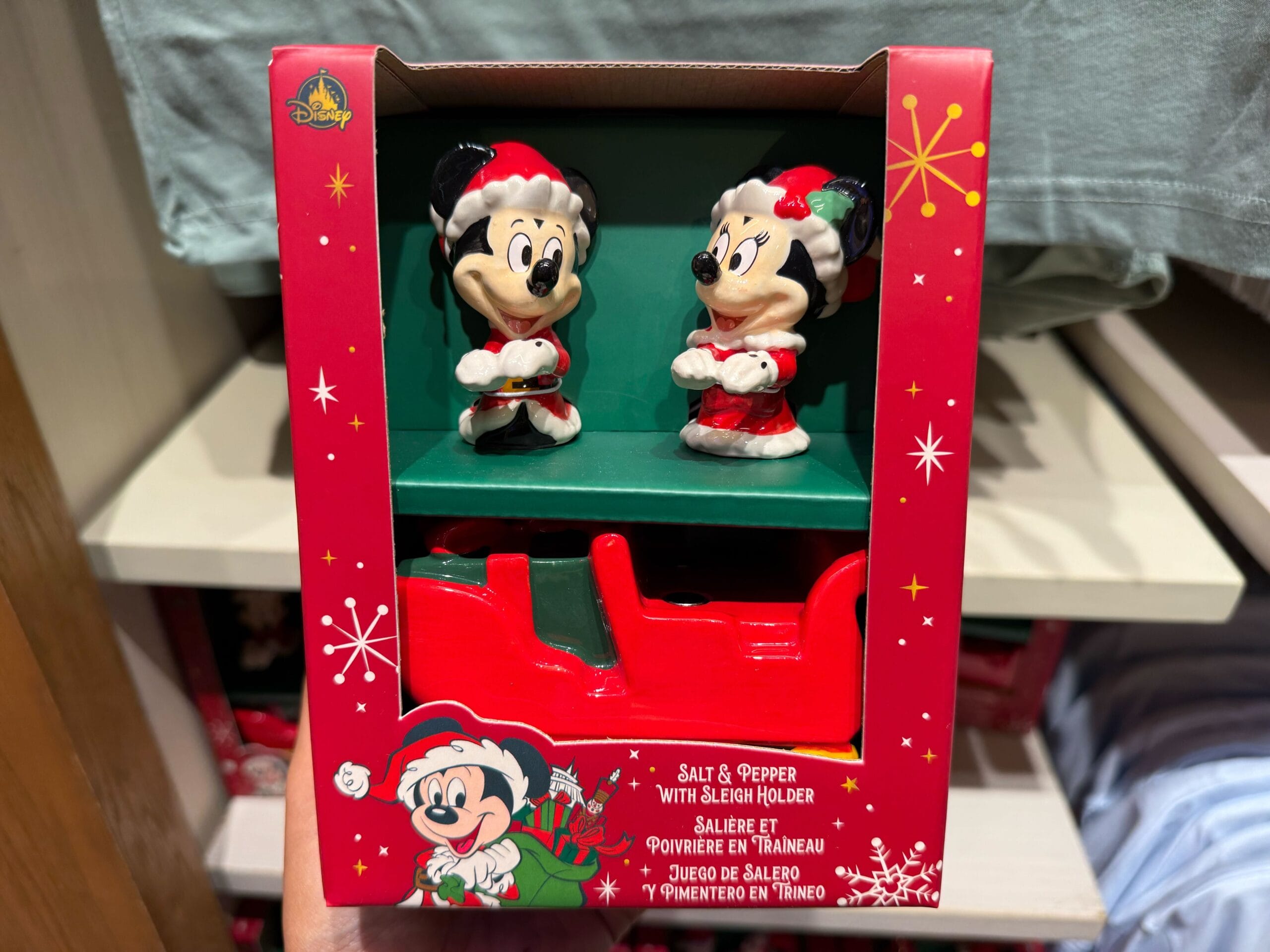 Mickey and Minnie Mouse salt and pepper shakers in a festive red sleigh—ideal for Disney Parks Christmas collections worldwide.