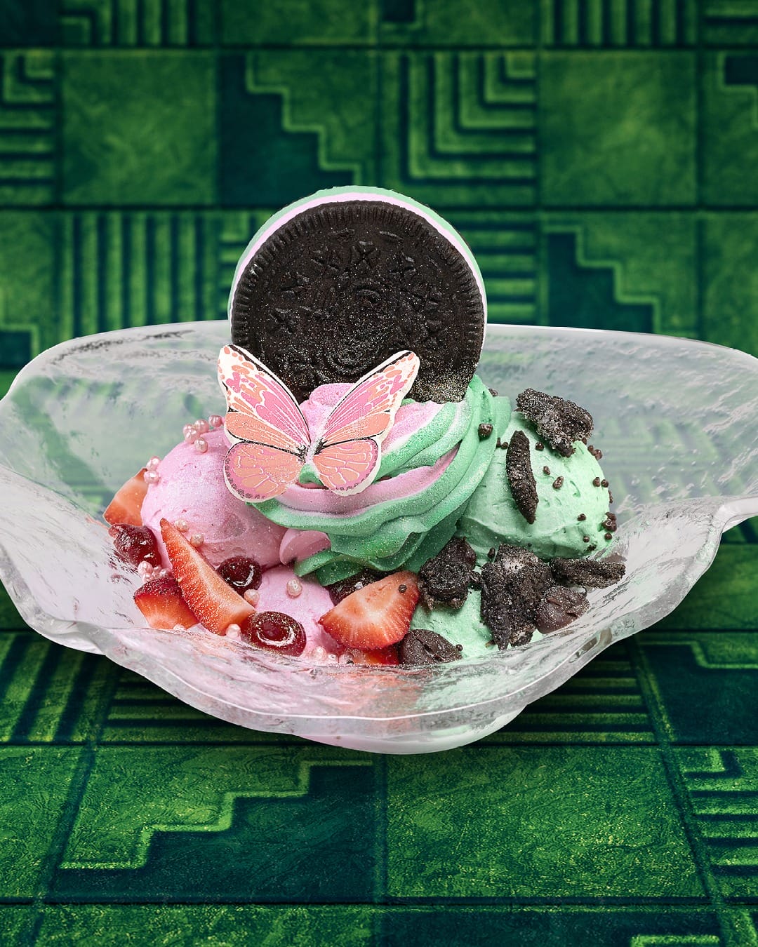 Colorful ice cream scoops with strawberries, cookie pieces, and a pink butterfly—more Universal Orlando style than Disney castle treats.