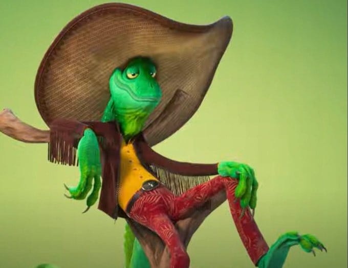 A green lizard in a large hat and red pants lounges on a tree branch, reminiscent of Zootopia 2’s quirky Finnick.