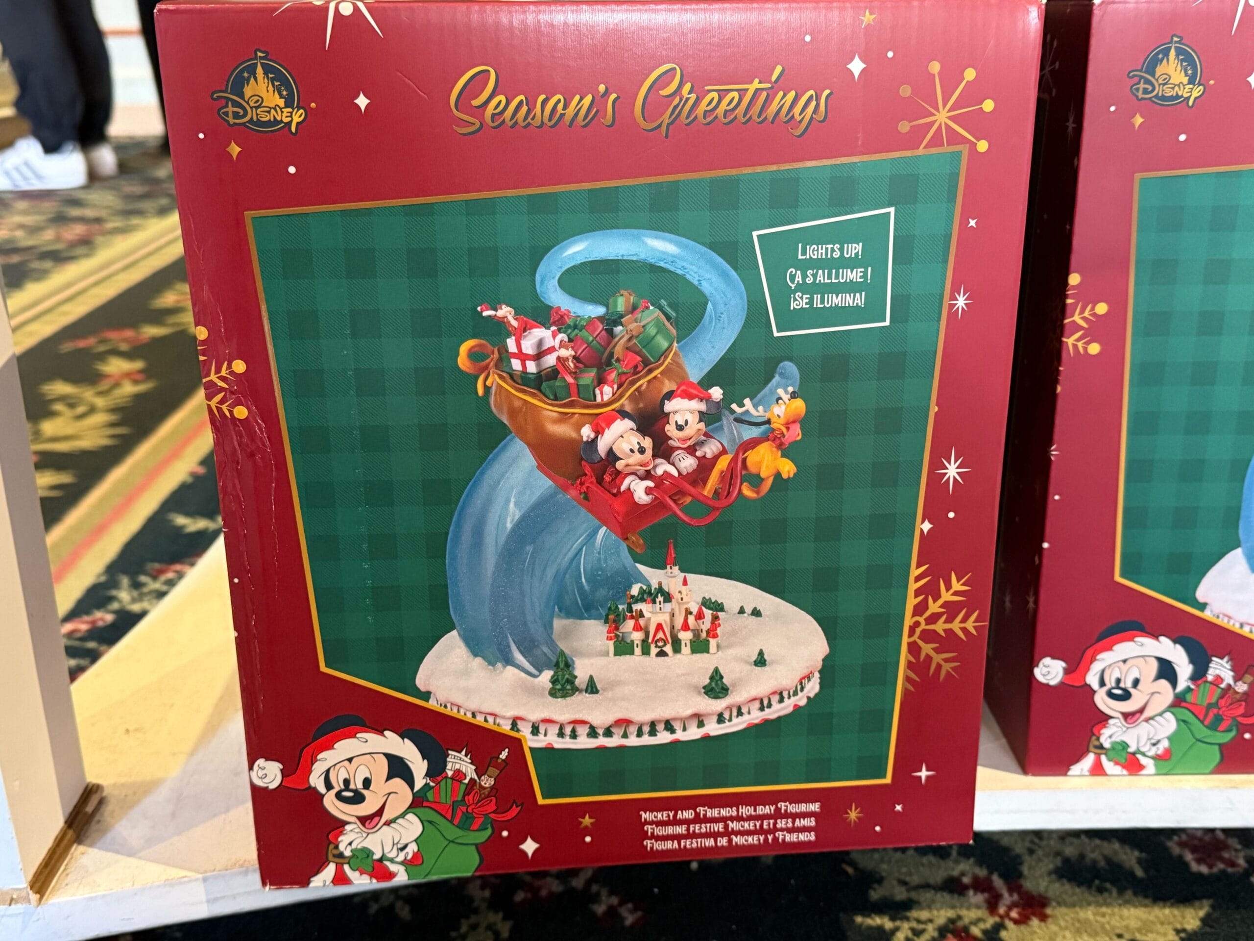 The Mickey and Friends Holiday Figurine is sold in a red box with gold Mickey snow flakes.