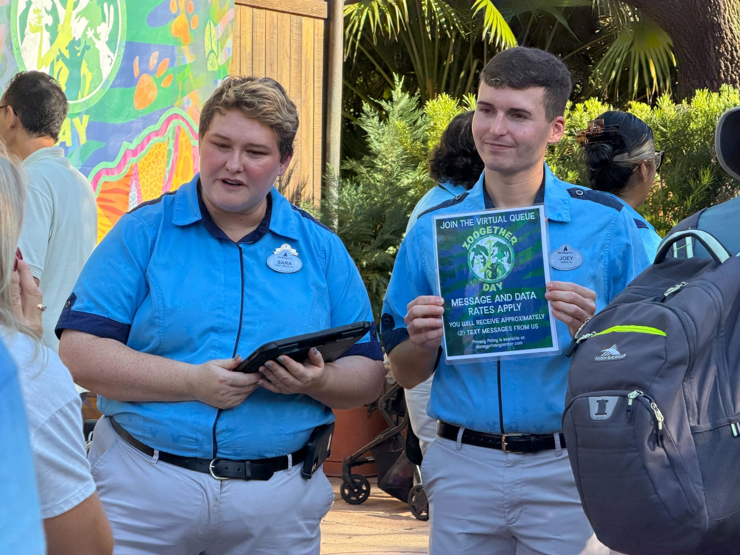 Cast Members sign guests up for virtual queue for the Zootopia 2 meet and greet at Animal Kingdom