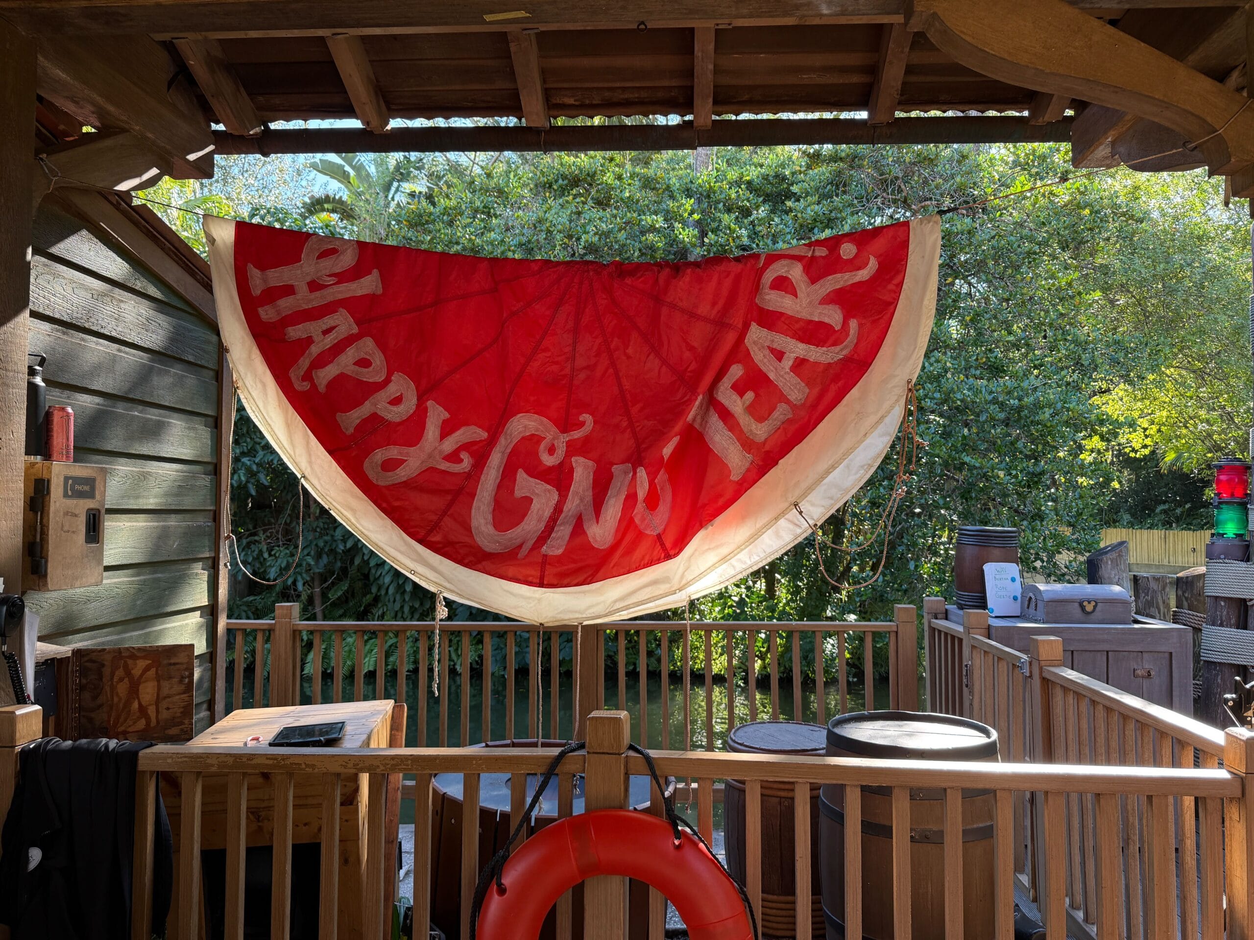 A festive red and white watermelon-shaped banner reading "Happy Gnu Year!" is displayed