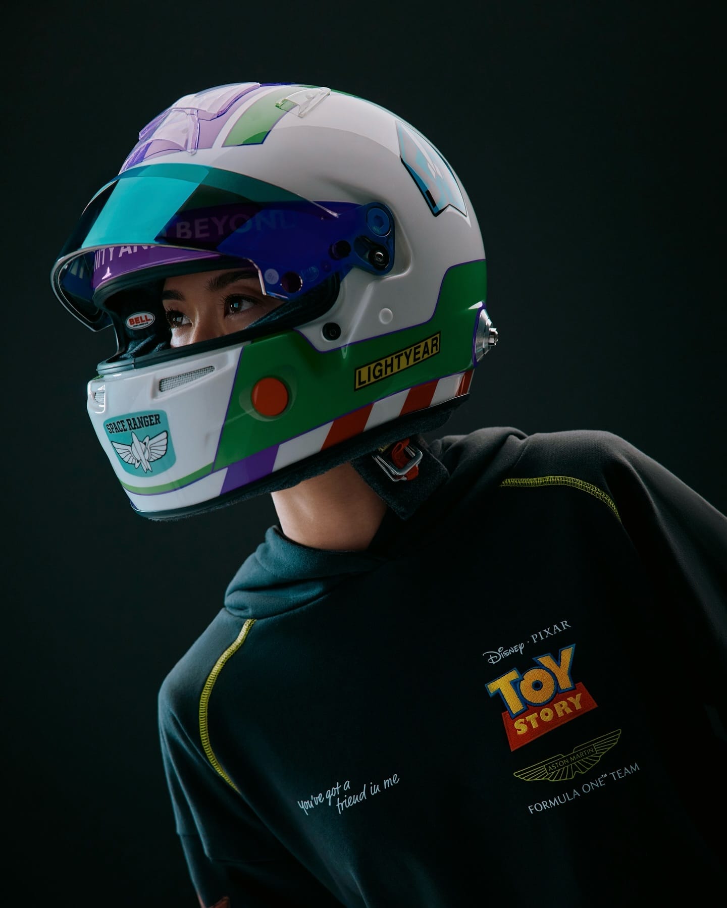 Guest sporting a Buzz Lightyear Formula 1 helmet and Disney collaboration gear, reminiscent of park-exclusive Tomorrowland merchandise.