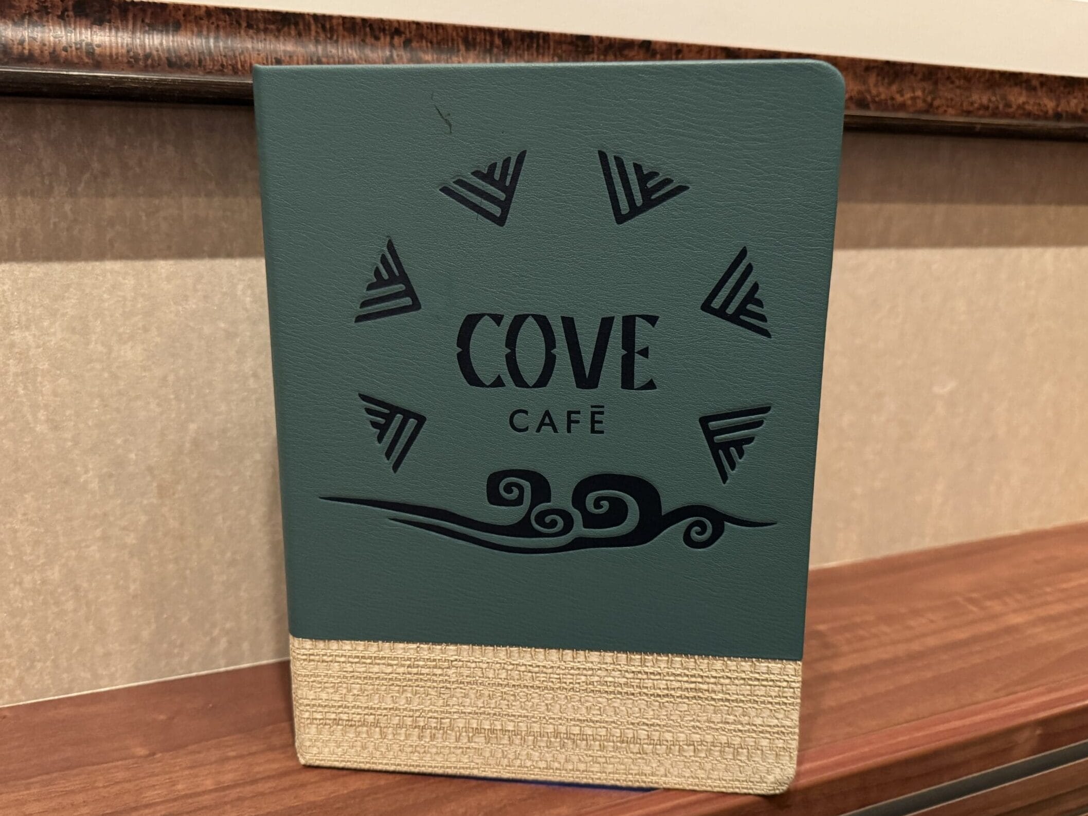 Adults can escape the hustle and bustle of the Disney Destiny by stopping in at the Cove Café and Cove Bar.