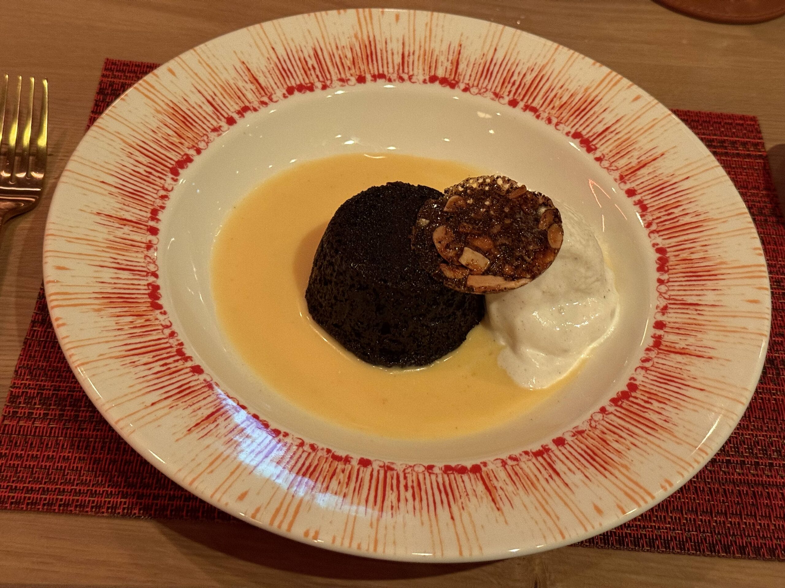 Decadent Chocolate Pudding, Apricot Jam, Warm Buttery Cream Sauce, Vanilla Ice Cream
