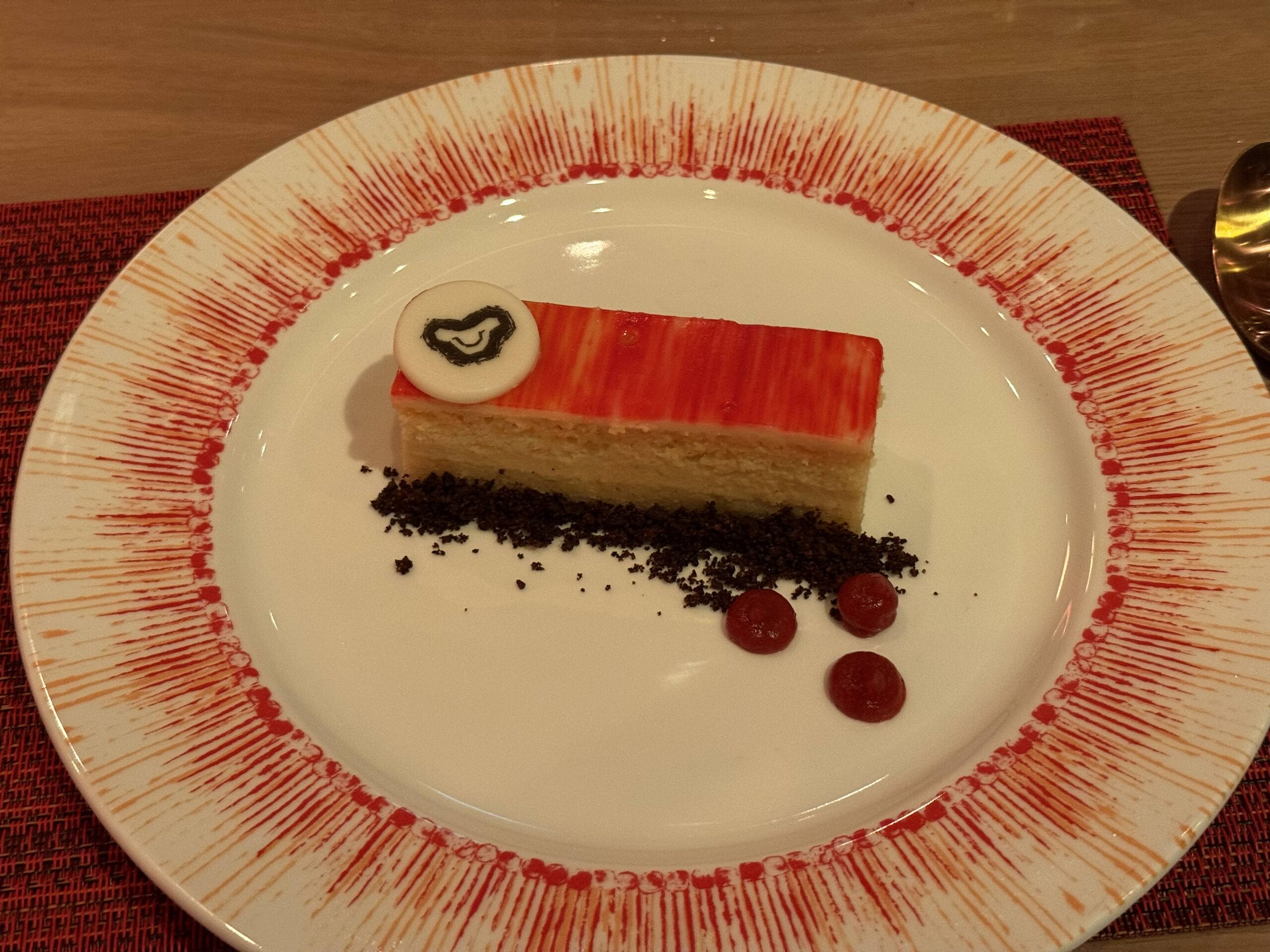 Vanilla Butter Cake, Passion Fruit Cremieux, White Chocolate Ganache, Passion Fruit Glaze, and Strawberry Hisbiscus Sauce