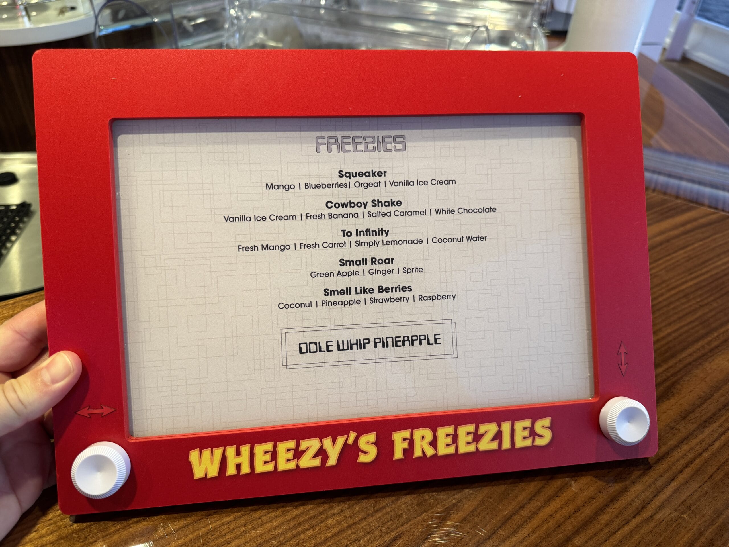 Wheezy's Freezies is a Toy Story-themed treat shop on Deck 12 that serves several frozen smoothies and DOLE Whips during your sailing on the Disney Destiny.