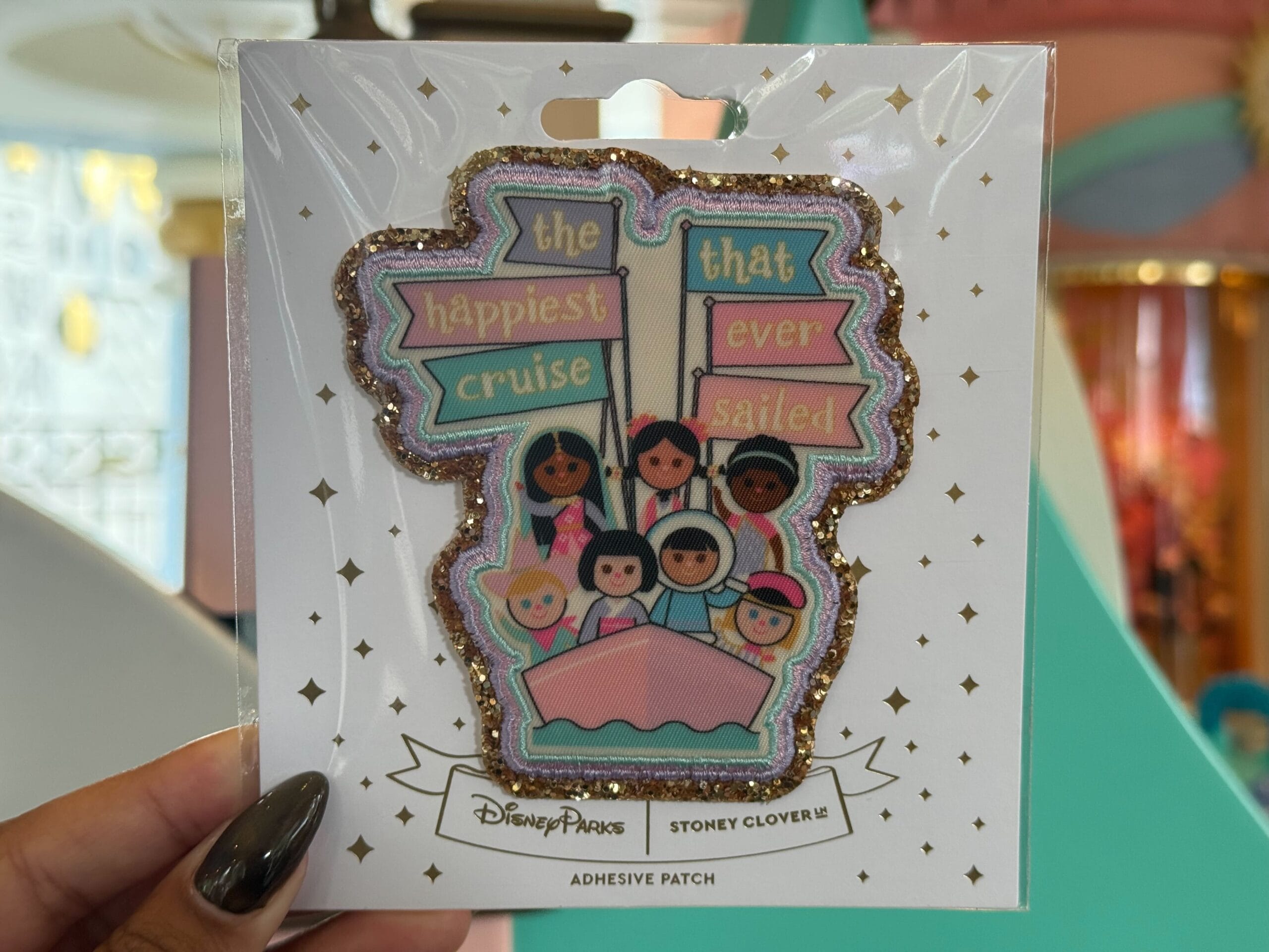 a patch from it's a small world inspied by the attraction poster