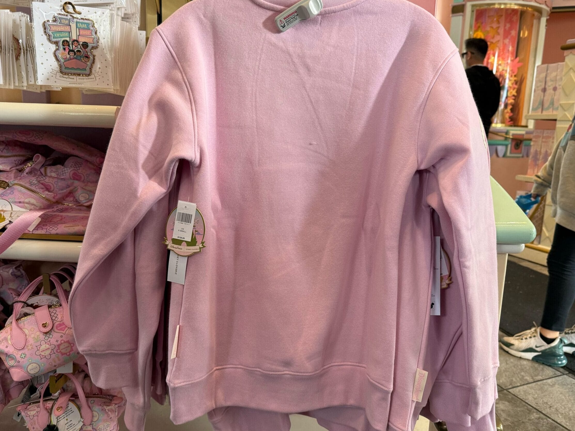 the back of the it's a small world sweatshirt