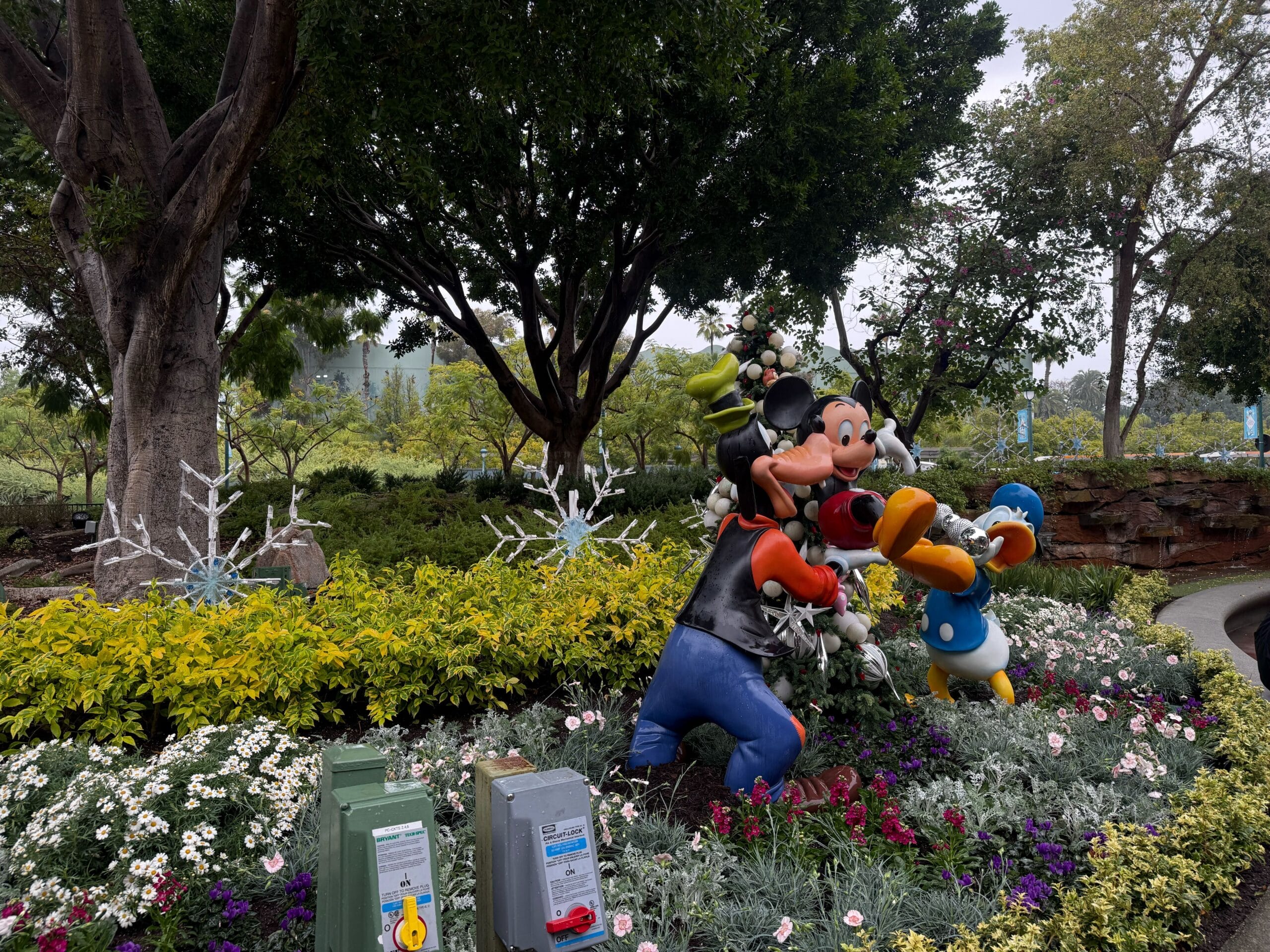 There's a statue of Mickey, Goofy, and Donald having fun.