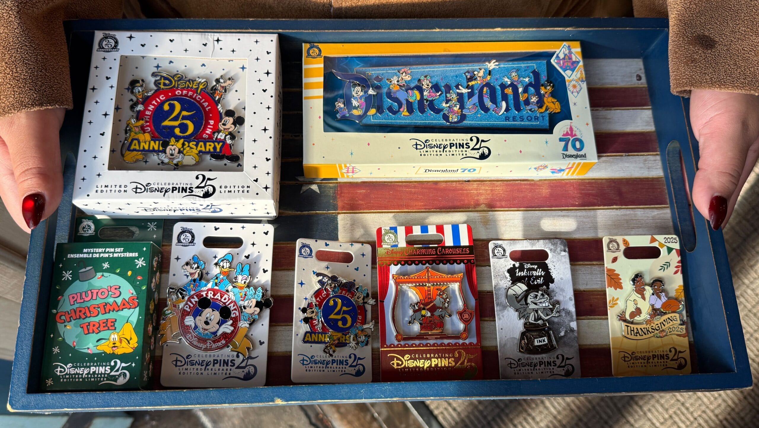 Disneyland Pin Tuesday: Jumbo 70th Anniversary Pin, Pluto's Christmas Tree Mystery Set, and More
