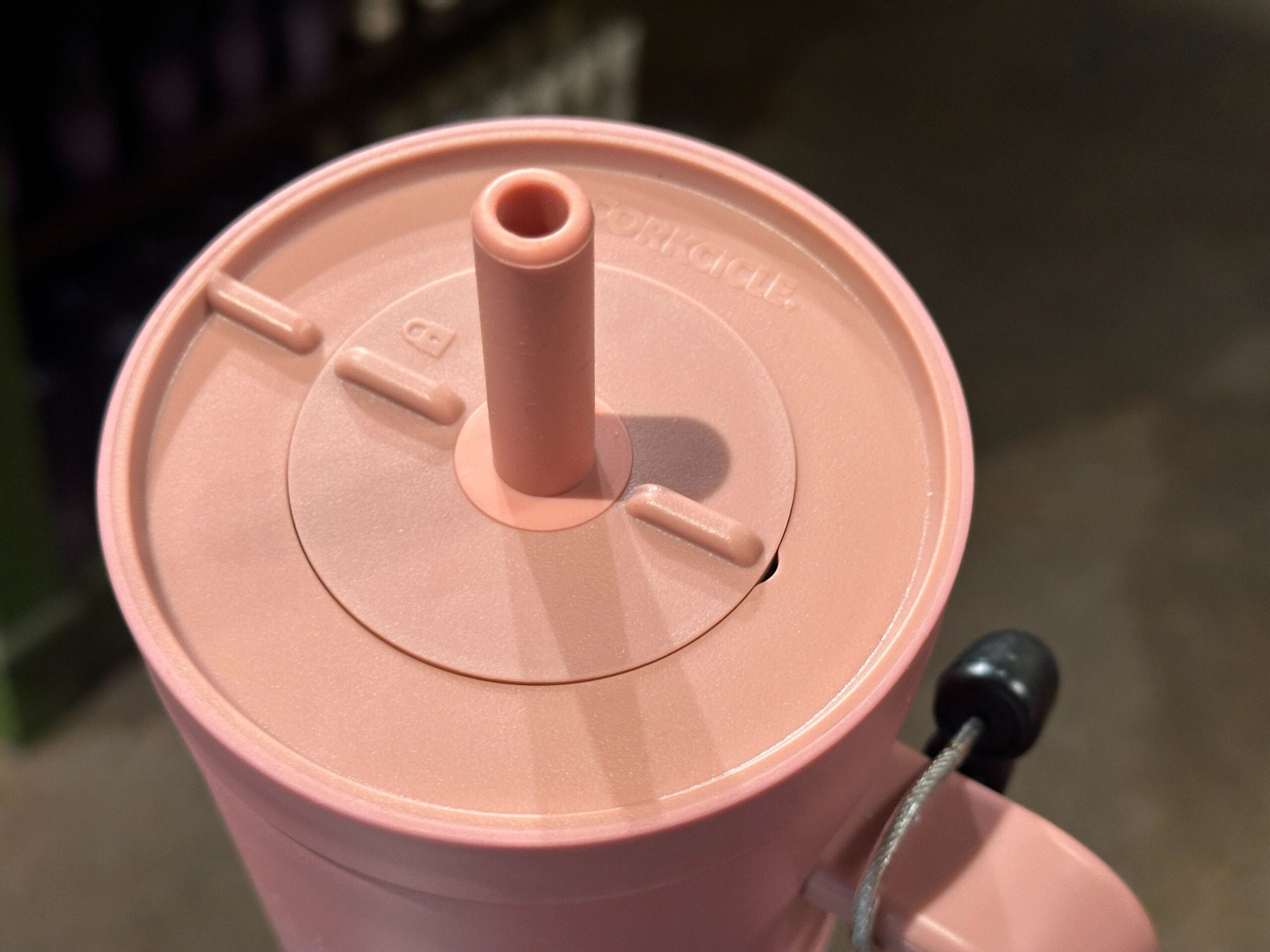 the lid of the pink tumbler