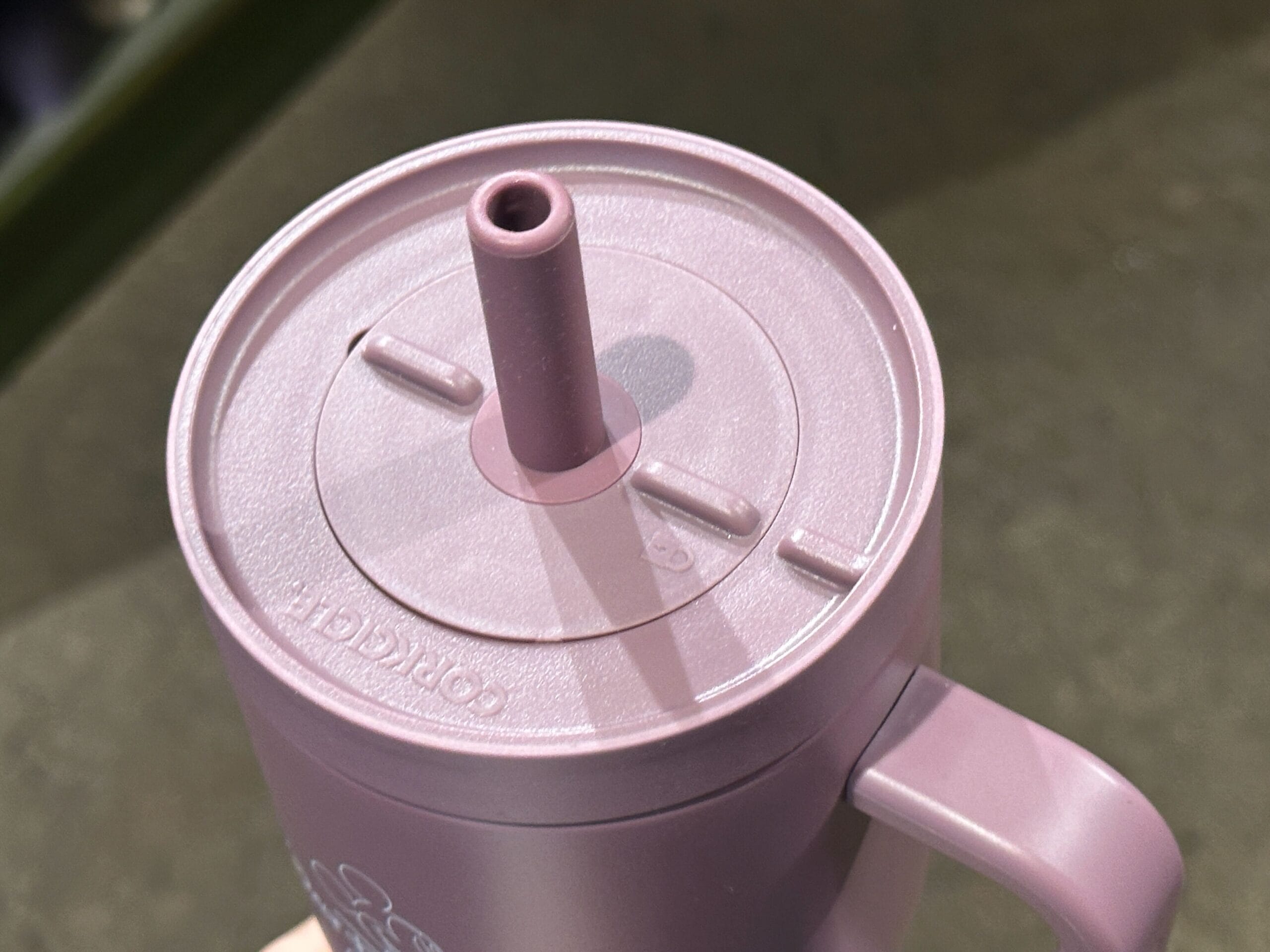 the lid of the purple tumbler