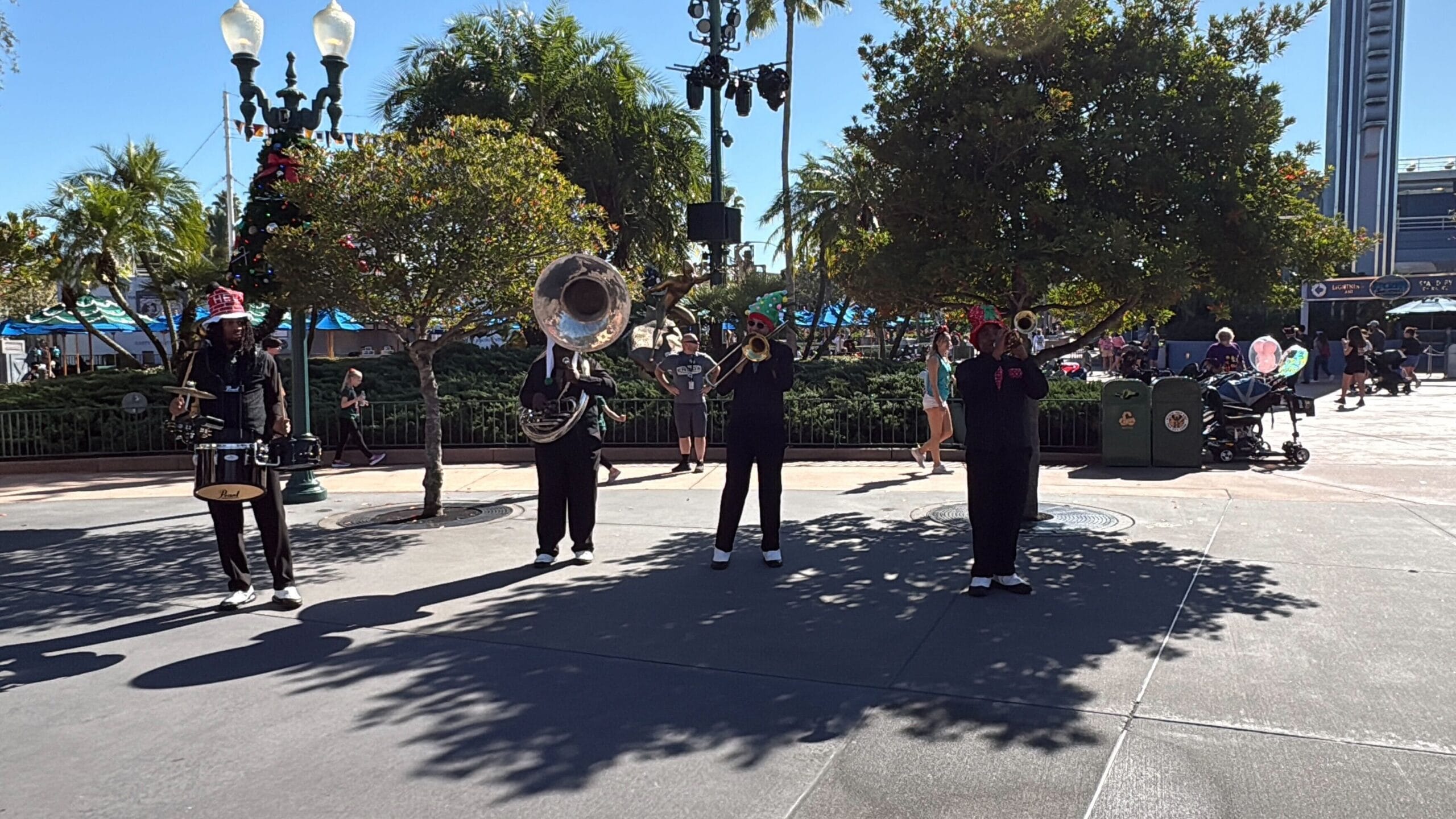 Seasonal entertainment at Disney's Hollywood Studios this winter includes Hollygroove Swingin', a brass band accompanied by Chip 'n' Dale.