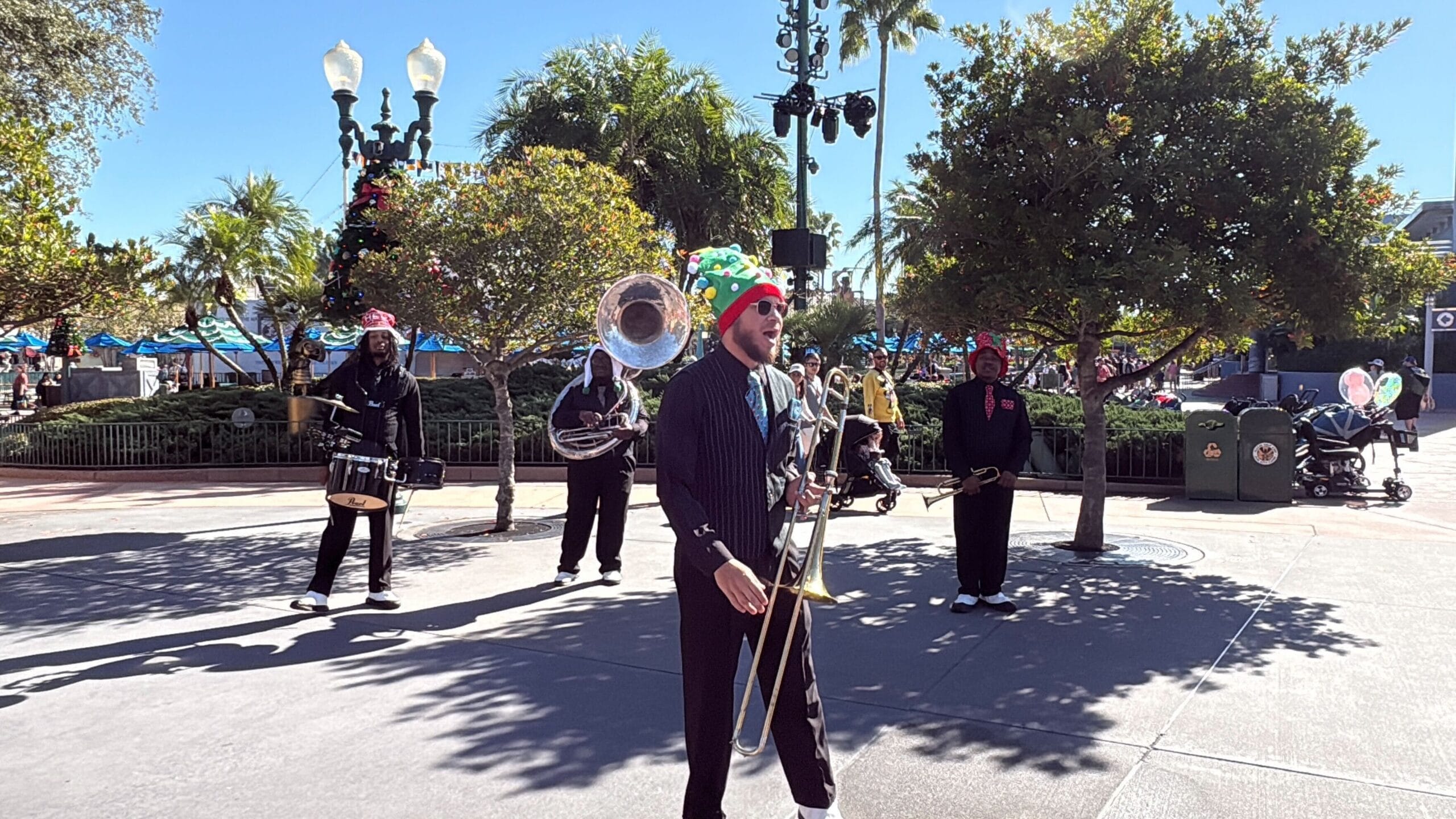 Seasonal entertainment at Disney's Hollywood Studios this winter includes Hollygroove Swingin', a brass band accompanied by Chip 'n' Dale.