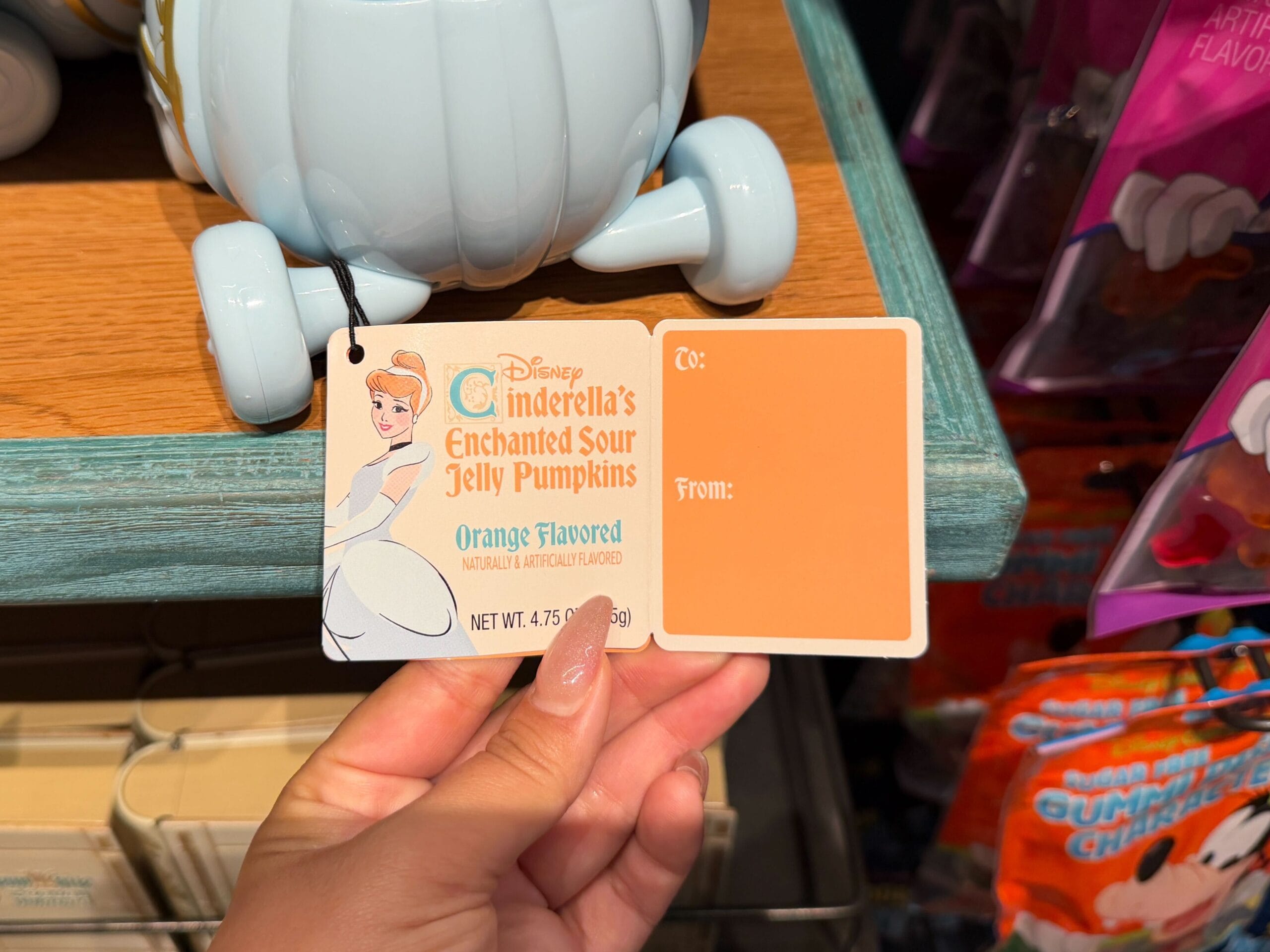Outside of Cinderella's Enchanted Sour Jelly Pumpkins candy tag.