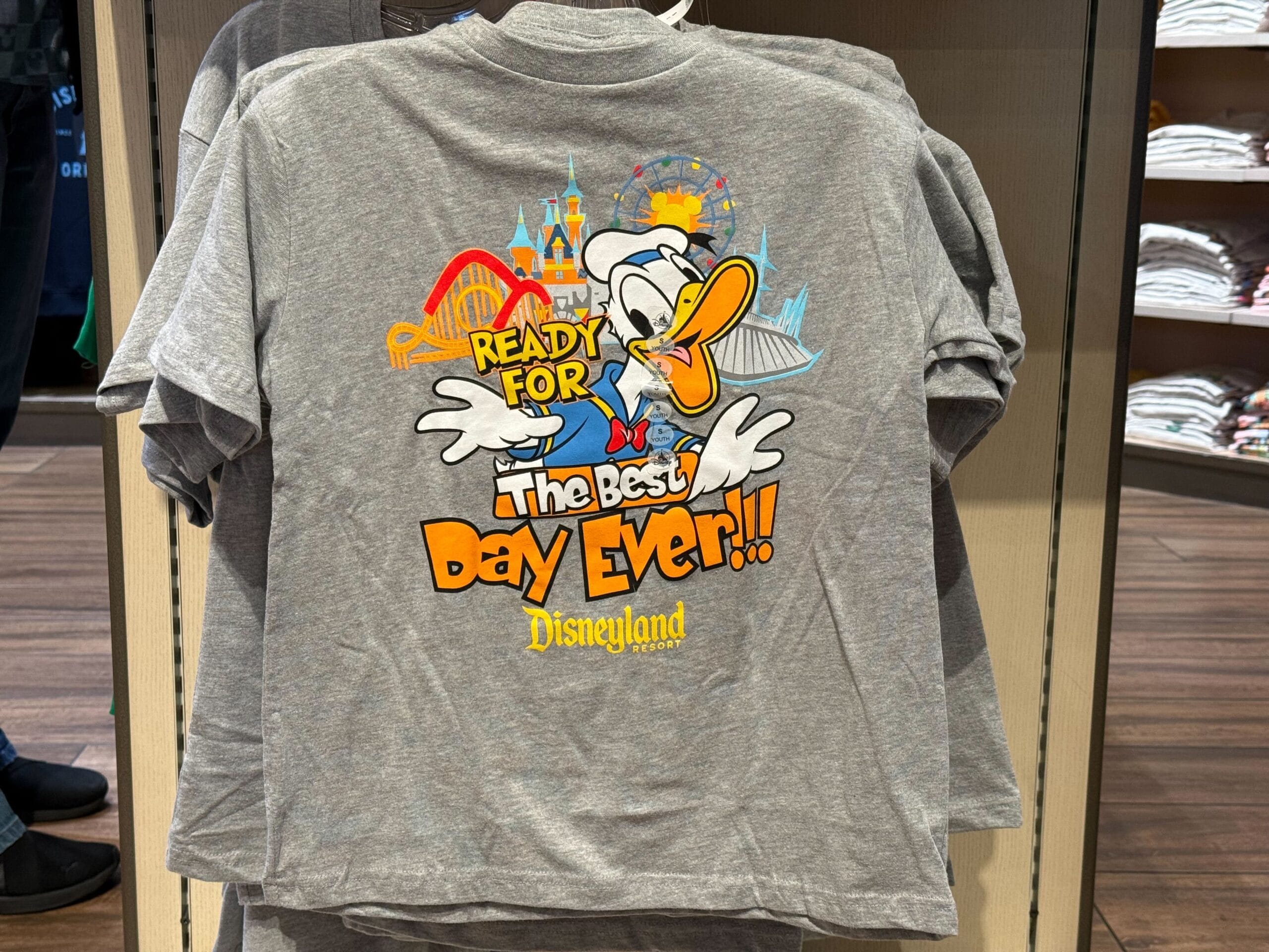Disneyland "Ready for the Best Day Ever" youth shirt with Donald Duck in front of famous Disneyland iconography.