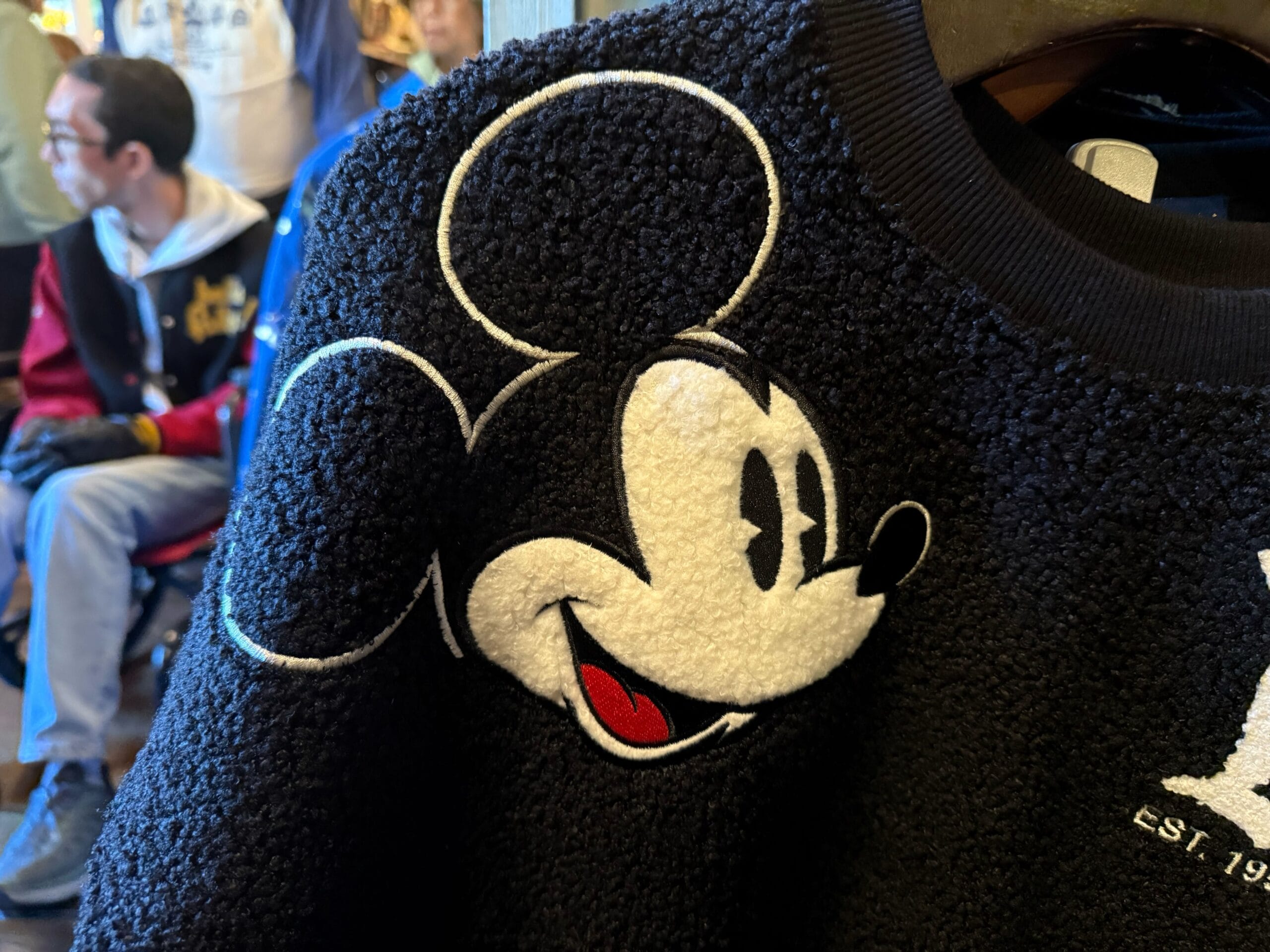 Shoulder of fluffy Mickey spirit jersey at Disneyland Resort.