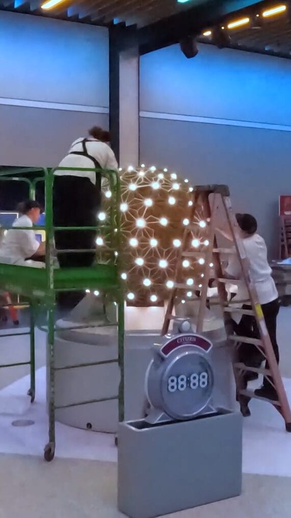 After all the gingerbread is in place, they go back and fill in all the cracks with icing.