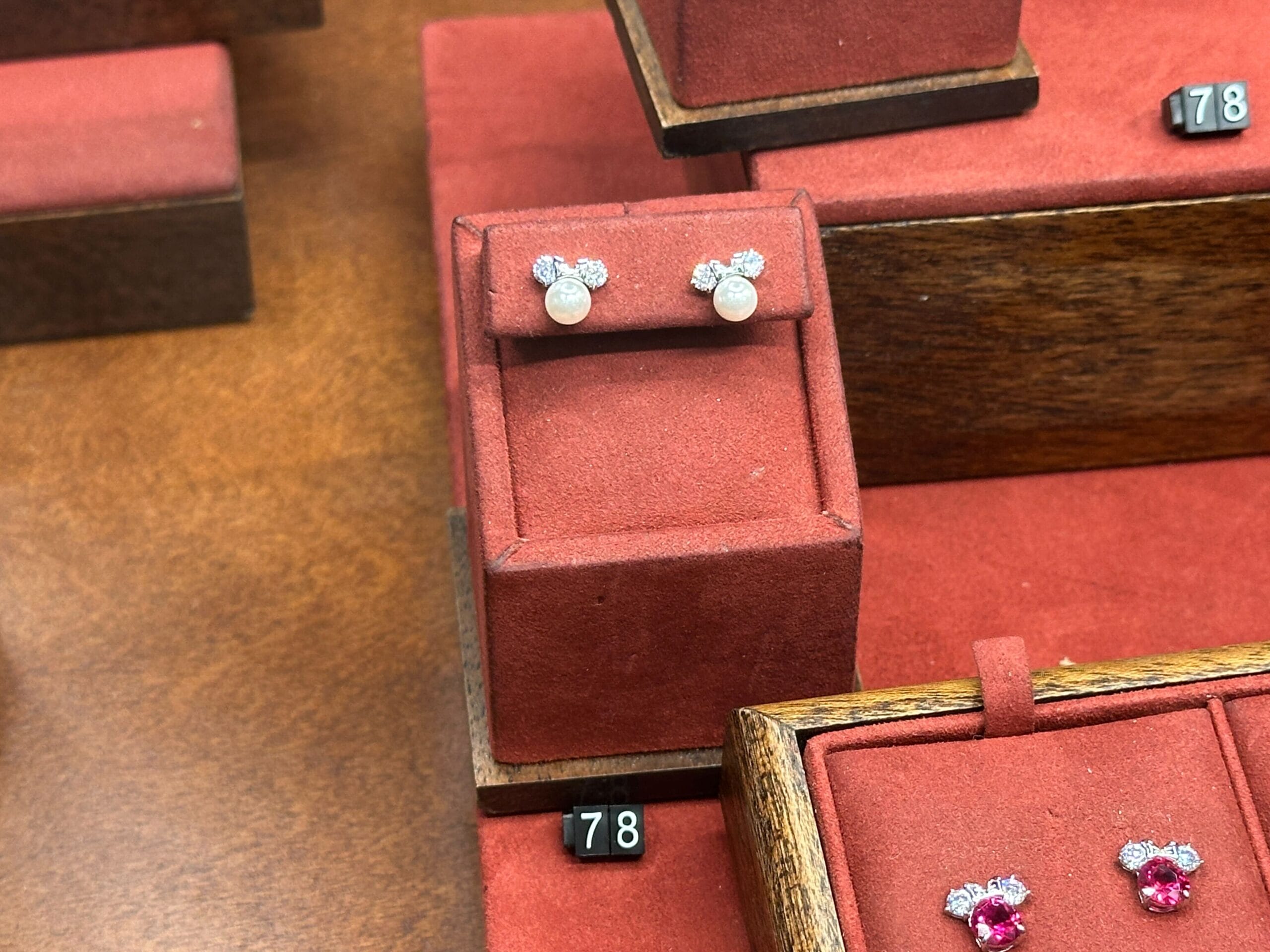 There is also a pair with pearls instead of birthstone. The same diamond ears and silver bow add to the sparkle and shine of the earrings.