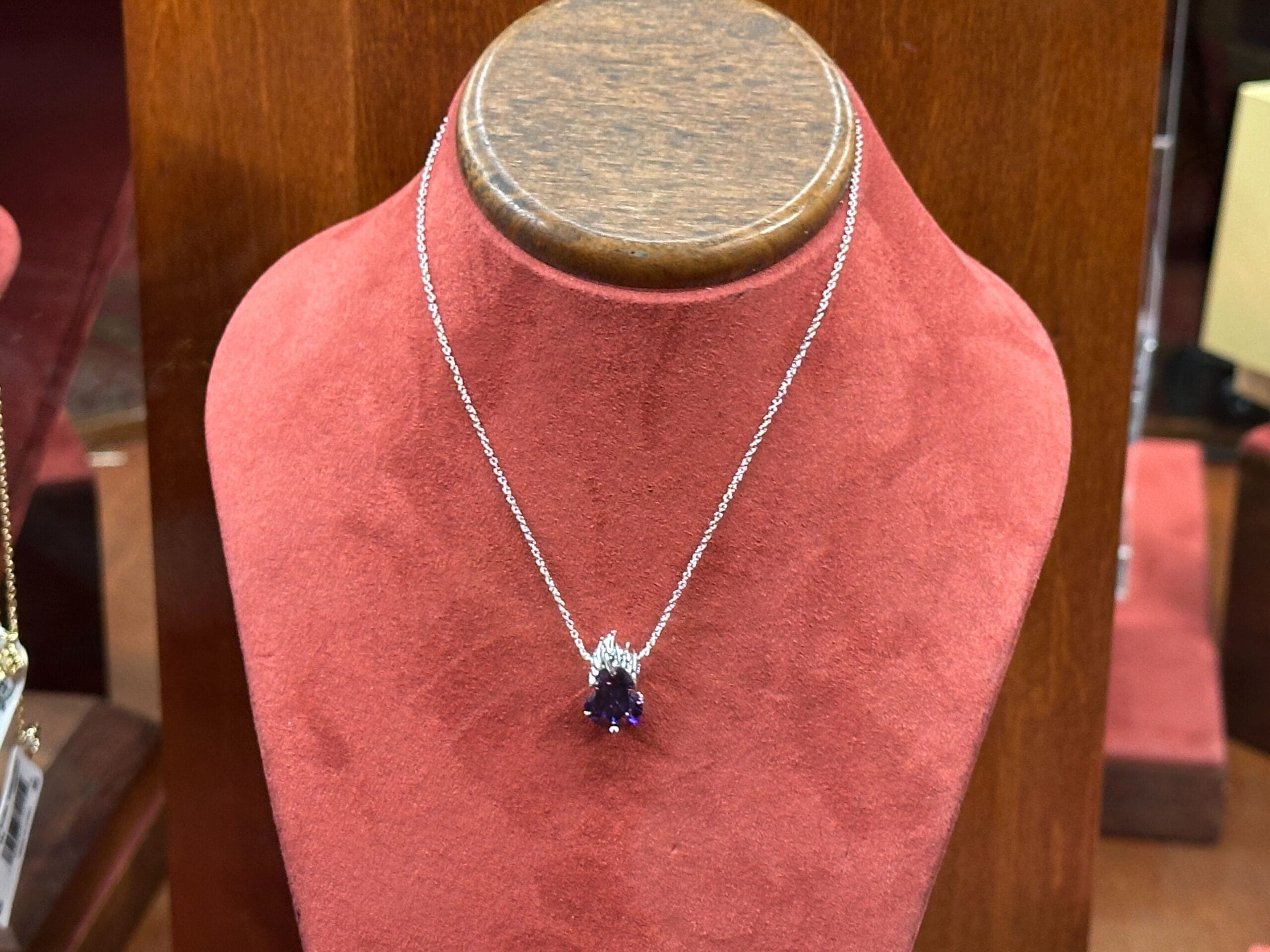 A slightly larger Ursula pendant hangs from a silver chain, making up this matching necklace.