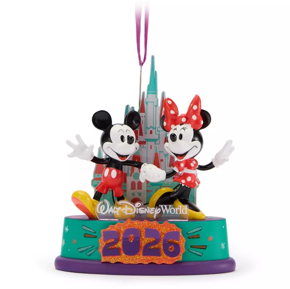 This souvenir ornament features aĀ Cinderella CastleĀ backdrop with Mickey and Minnie holding hands.