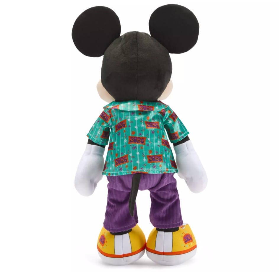 Mickey wears a satin tourist shirt with 2026 logos and a pixie dust pattern along with corduroy pants and canvas sneakers to complete the look.