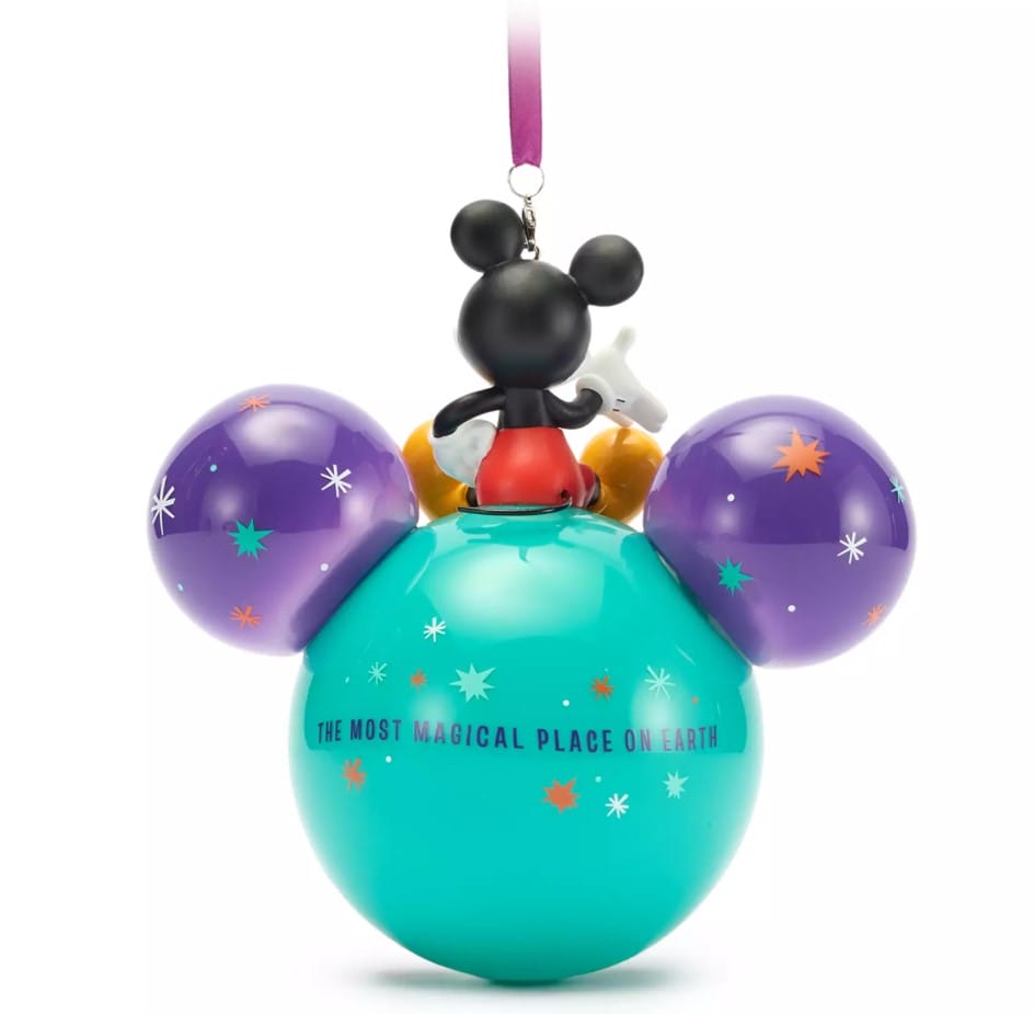 ''The Most Magical Place on Earth'' text is on the back. It has a glossy finish and a satin ribbon for hanging.