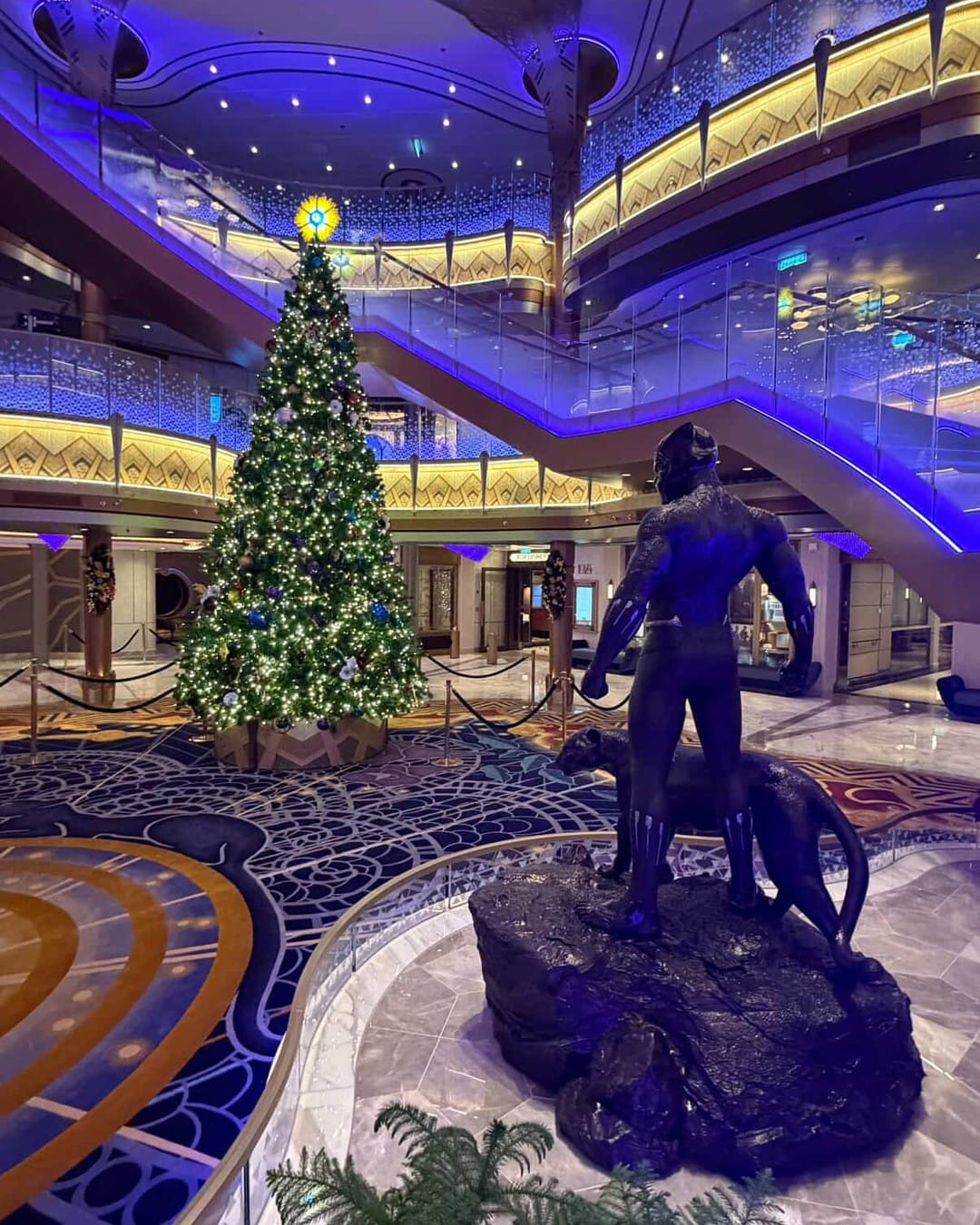 Disney Cruise Line shared photos of the Disney Destiny's unique Christmas tree lighting up the new ship's Grand Hall.