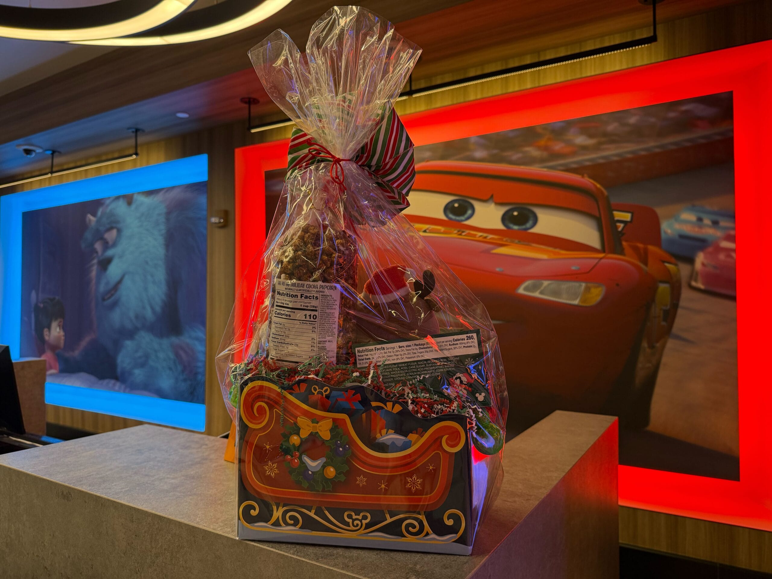 Disneyland Resort's Pixar Place Hotel is offering a special holiday gift basket this month that includes Christmas merchandise and treats.