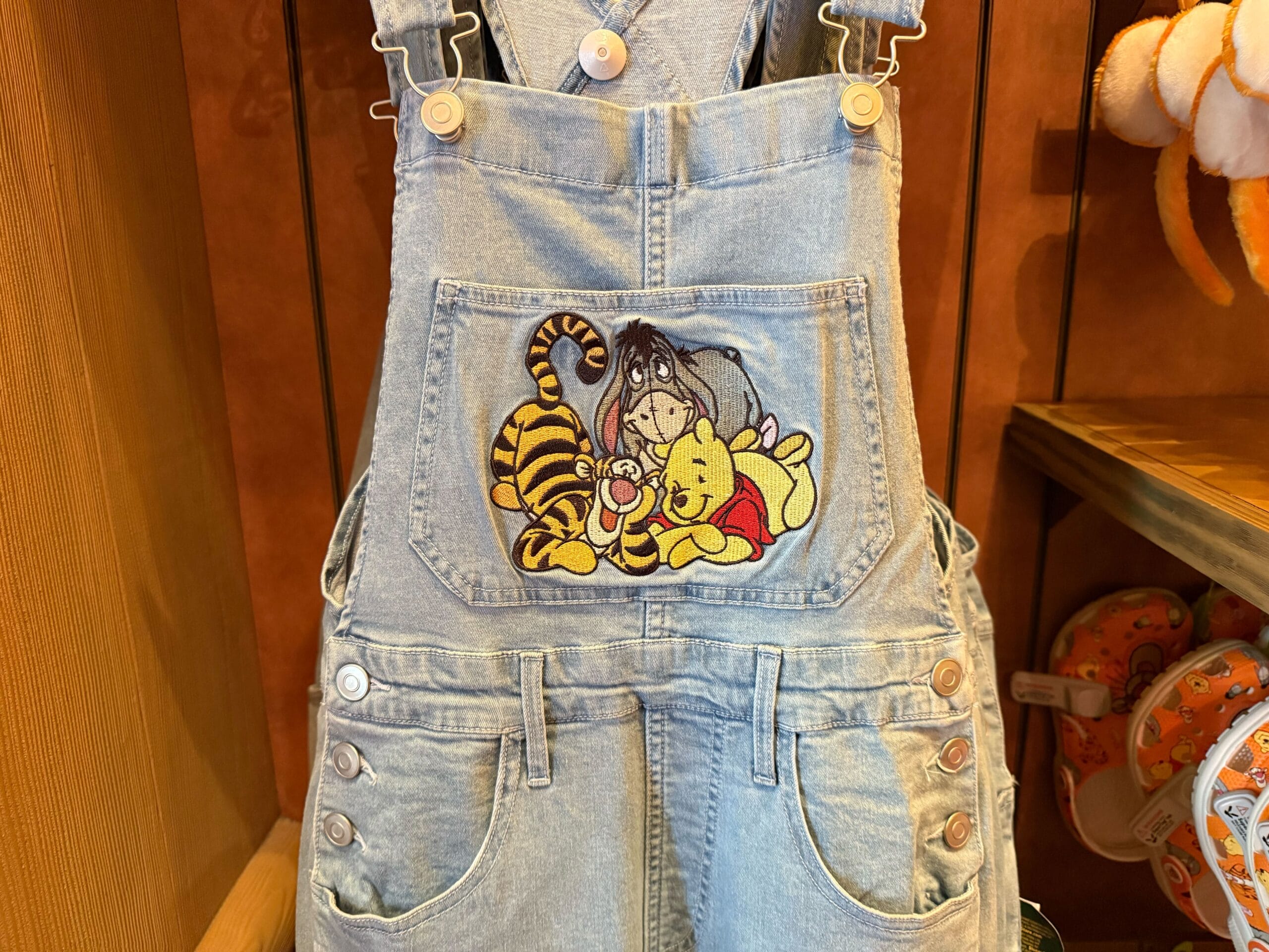 Show your love for Pooh, Eeyore, and Tigger with new Winnie the Pooh denim overalls from Disneyland Resort.