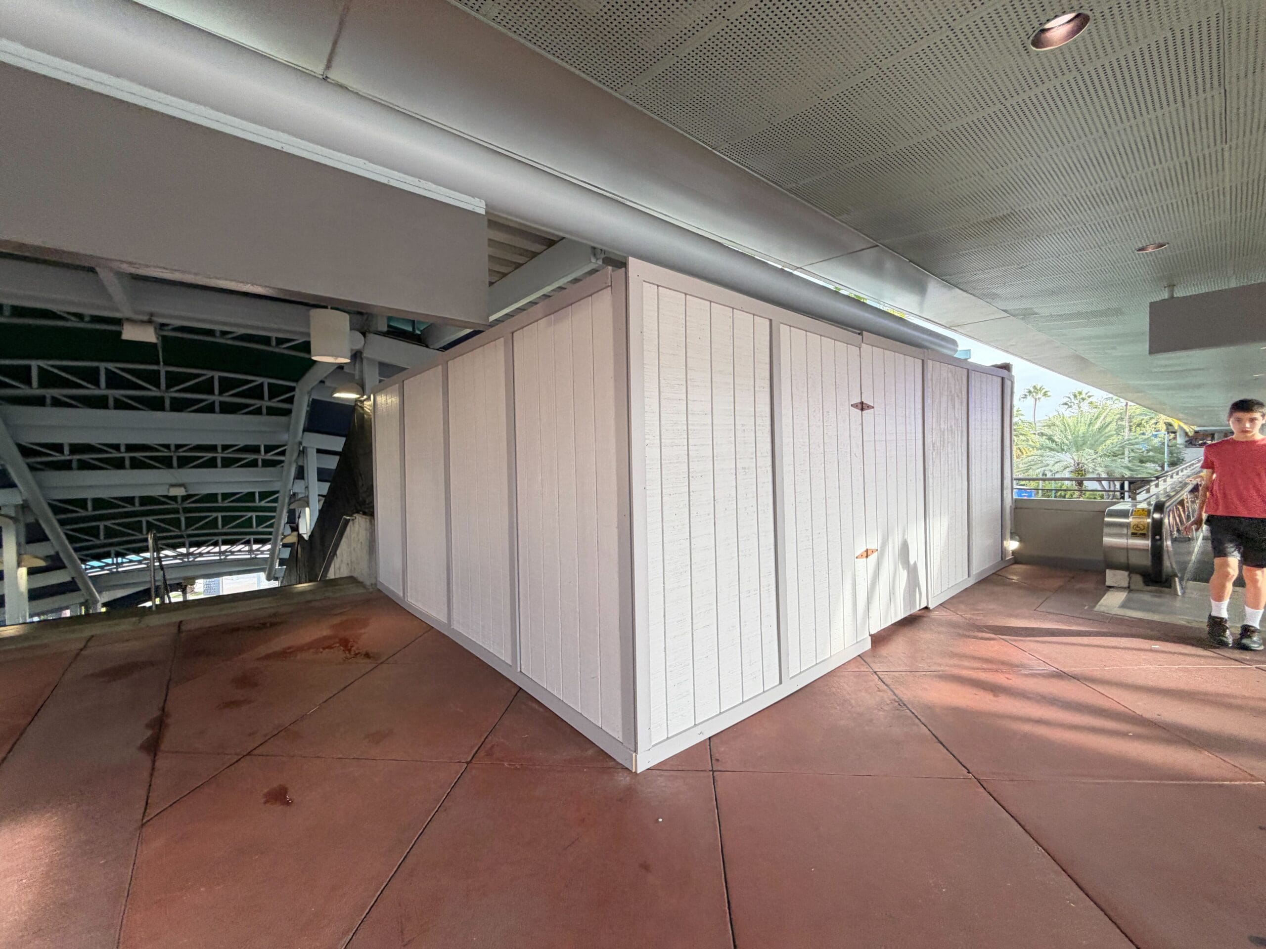 Temporary construction walls blocked a pair of escalators leading to and from the valet parking area at Universal Orlando