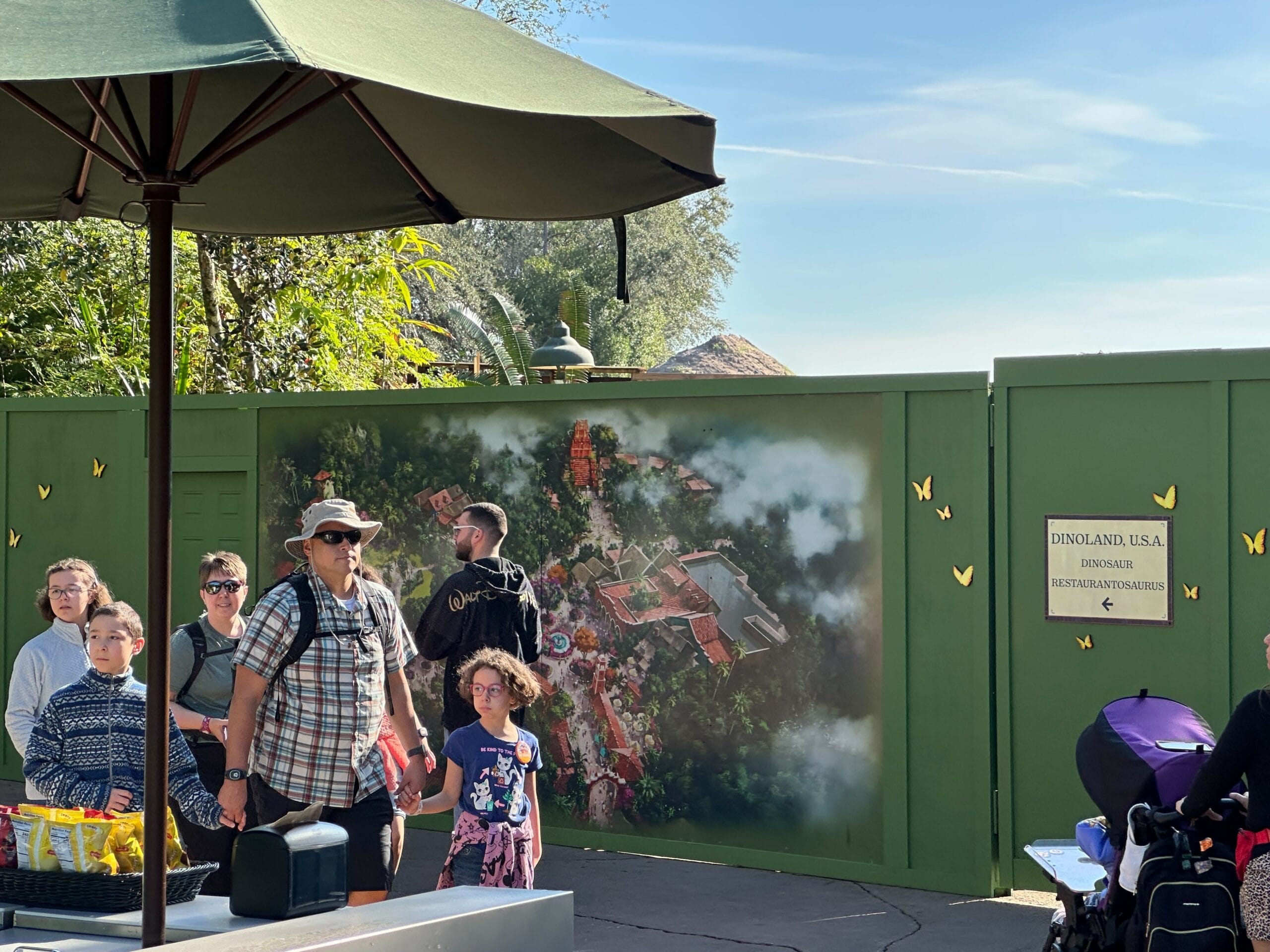 There is also some tall fencing visible around a nearby dirt pile.