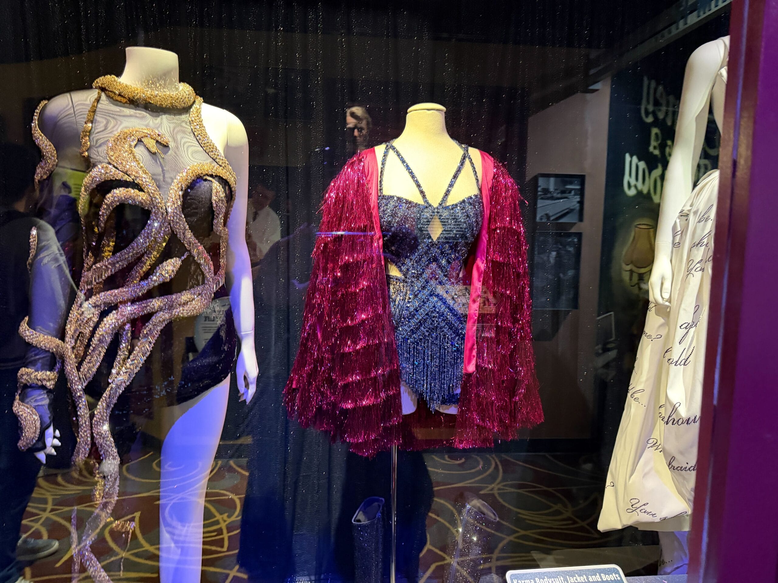 Three of Taylor Swift's The Eras Tour costumes are now on display at Walt Disney World to advertise the release of the Eras Tour docuseries and final show concert film.