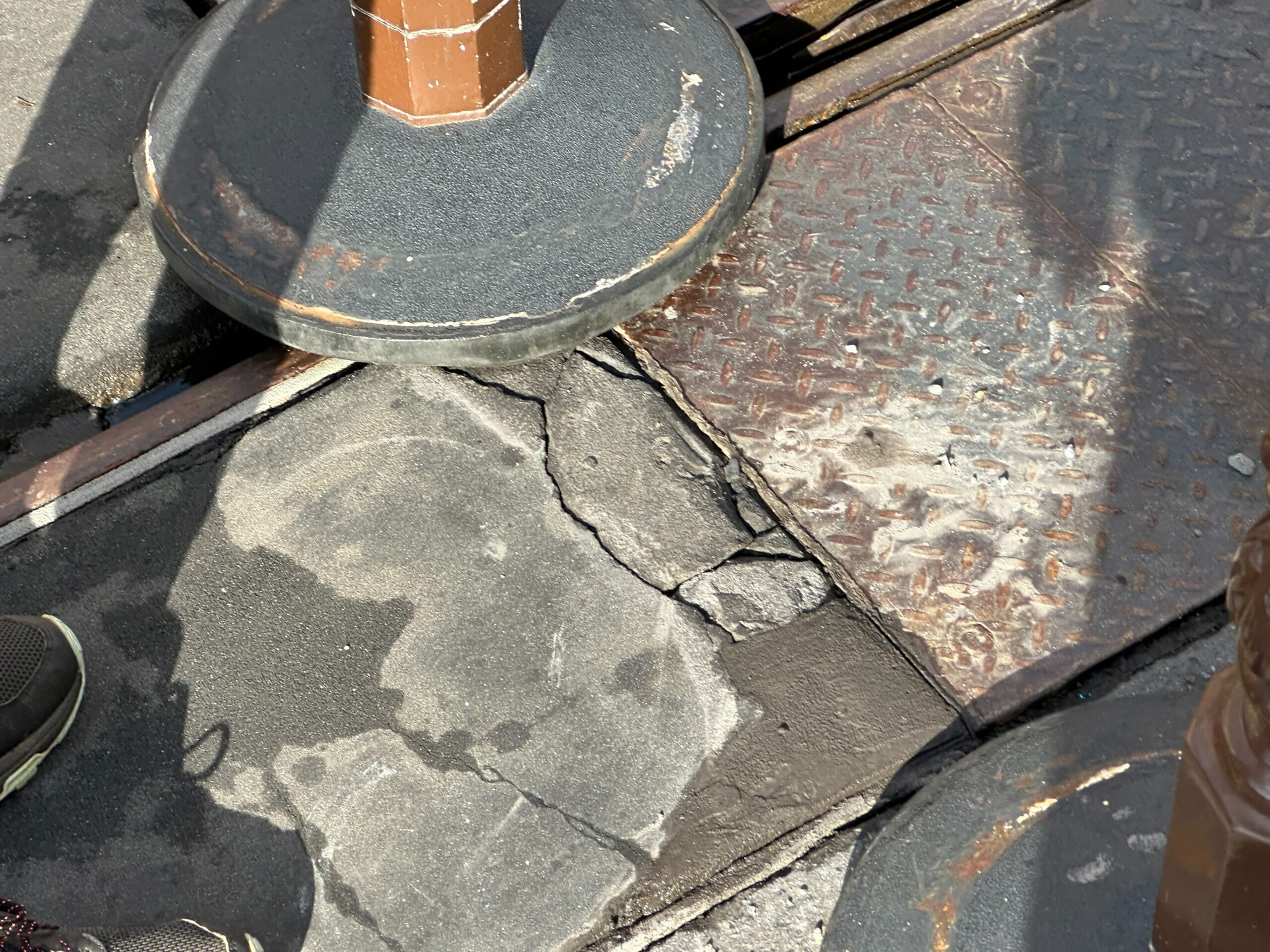 Sections of damaged pavement on Main Street, U.S.A. at Magic Kingdom are affecting trolley operations and potentially guest photos.