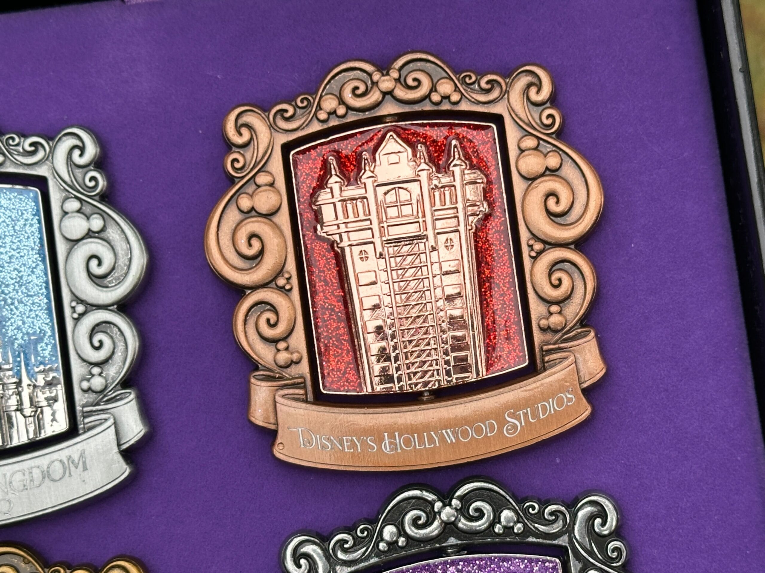 The Tower of Terror is pictured against a red sparkly background.