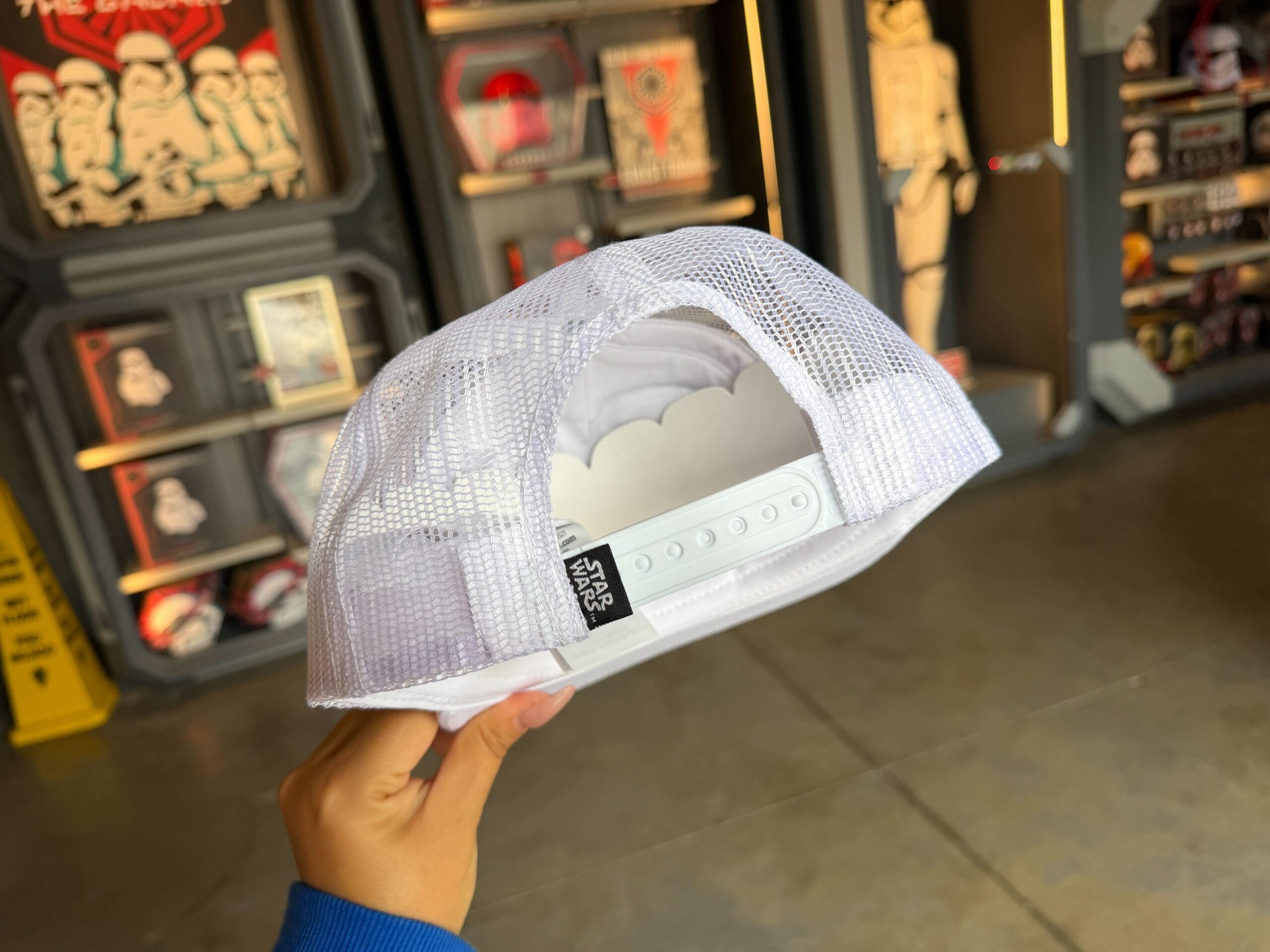 A black Star Wars label is on the back, next to the adjustable strap.